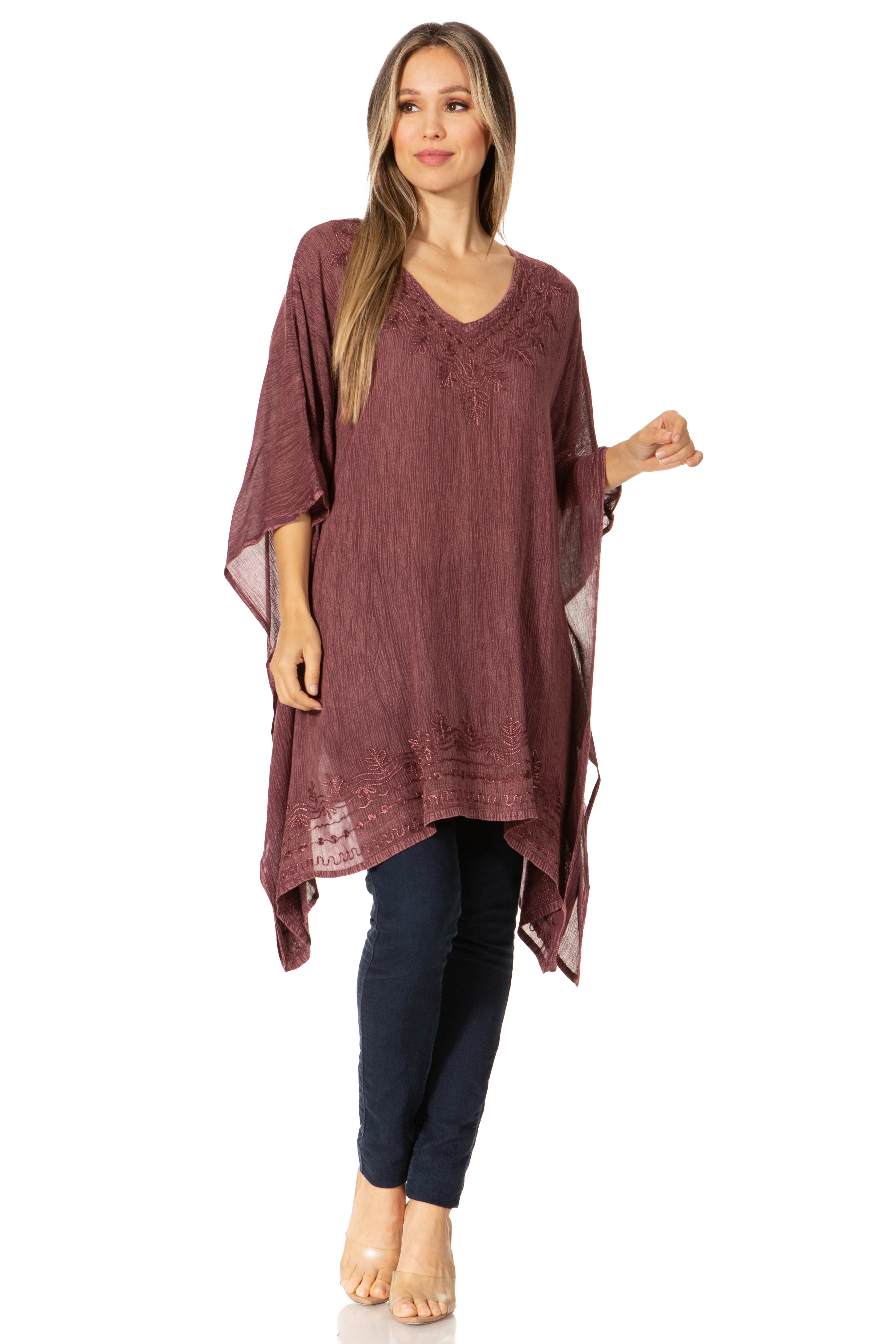 Woman wearing a burgundy tunic with a white background