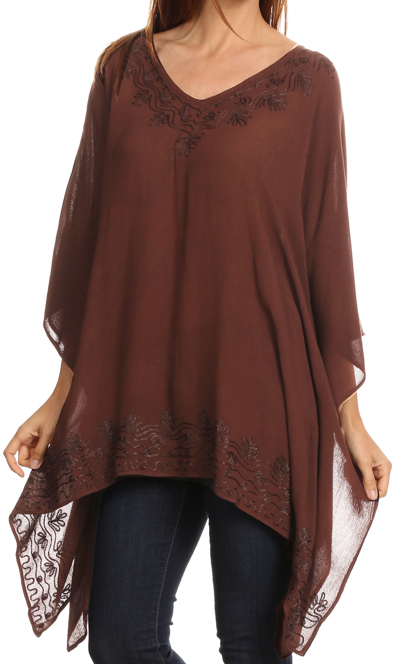 Brown poncho with lace details over a white background
