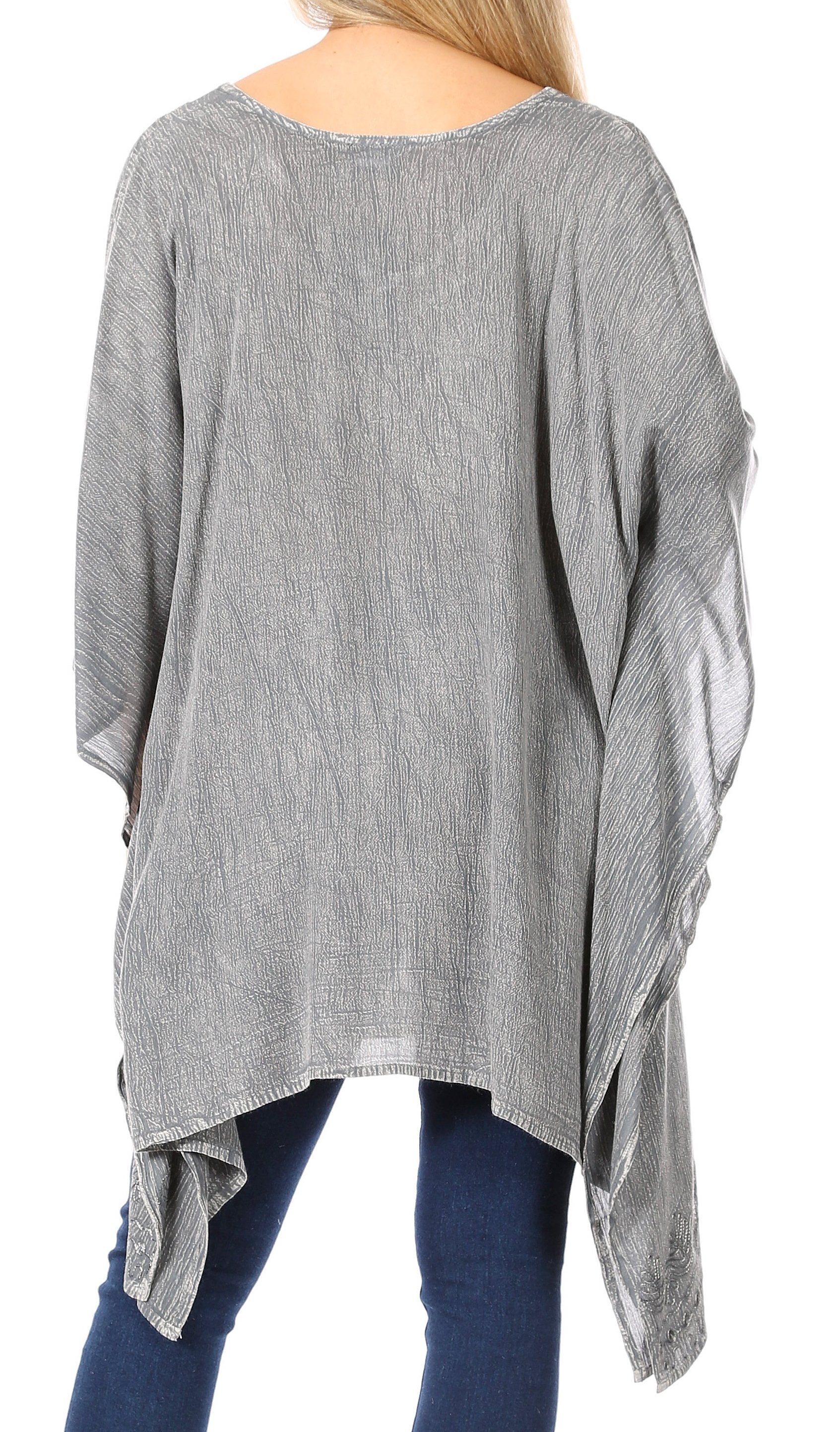 Gray oversized shirt with sheer sleeves worn by a person on a white background