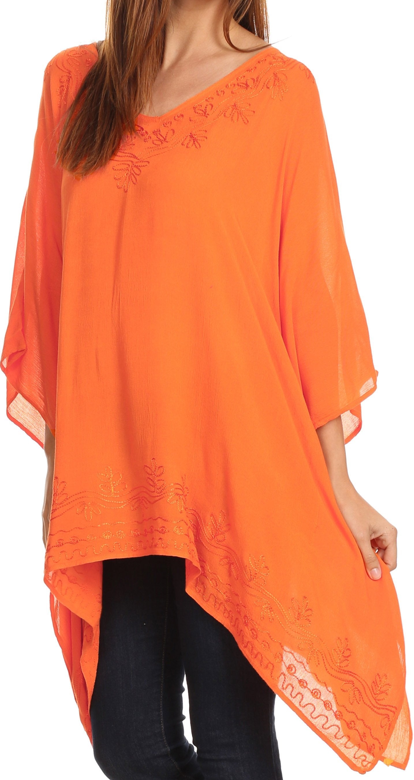 Orange lace-trimmed top worn by a person on a white background