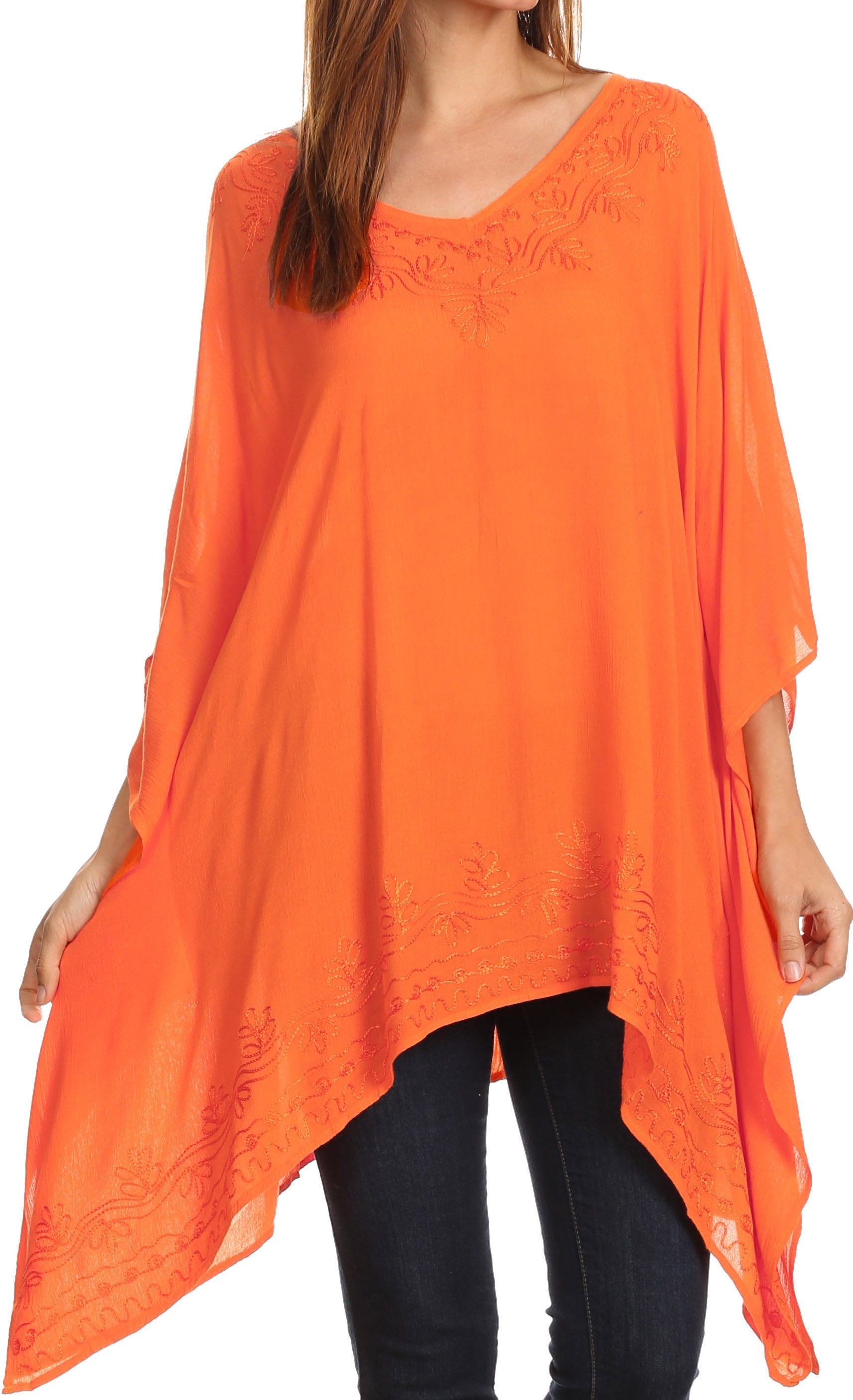 Orange poncho worn by a person on a white background