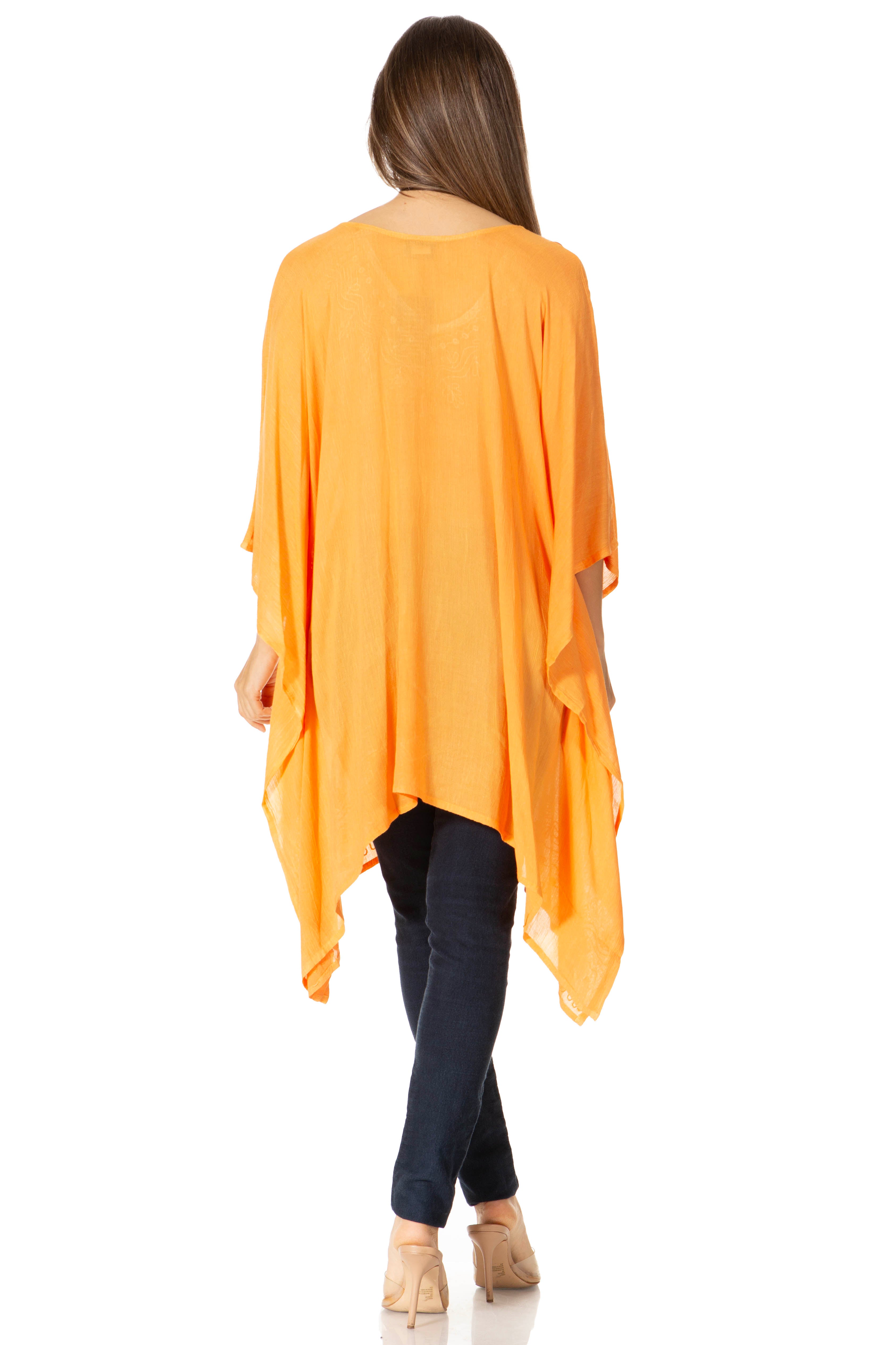 Woman wearing an orange kimono-style garment on a white background