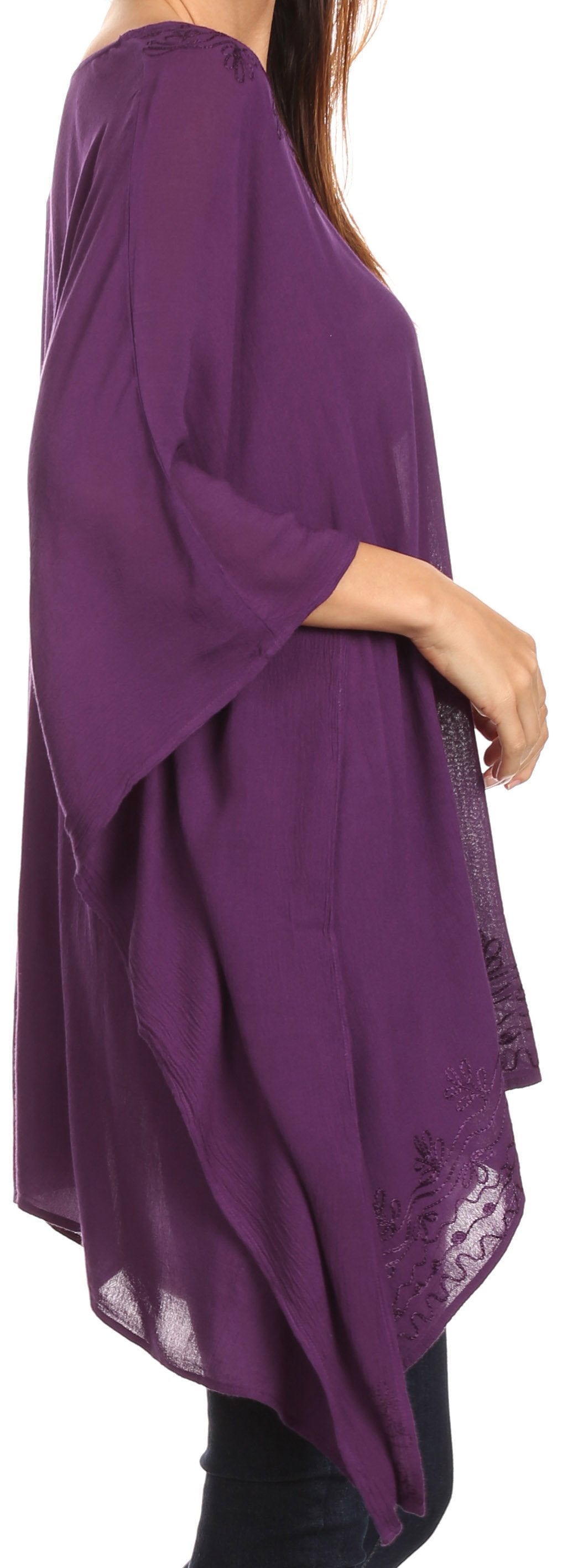 Purple long-sleeve top worn by a person on a white background
