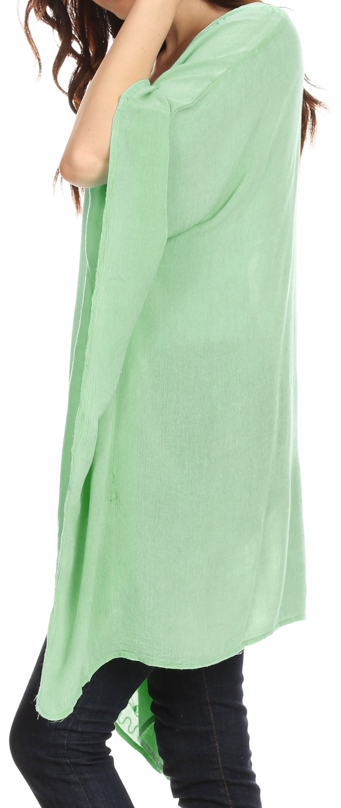 Light green oversized shirt worn by a person on a white background