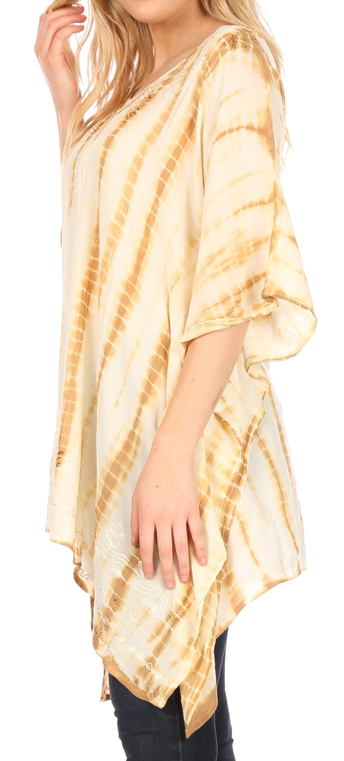 Woman wearing a beige tie-dye kimono-style top on a white background