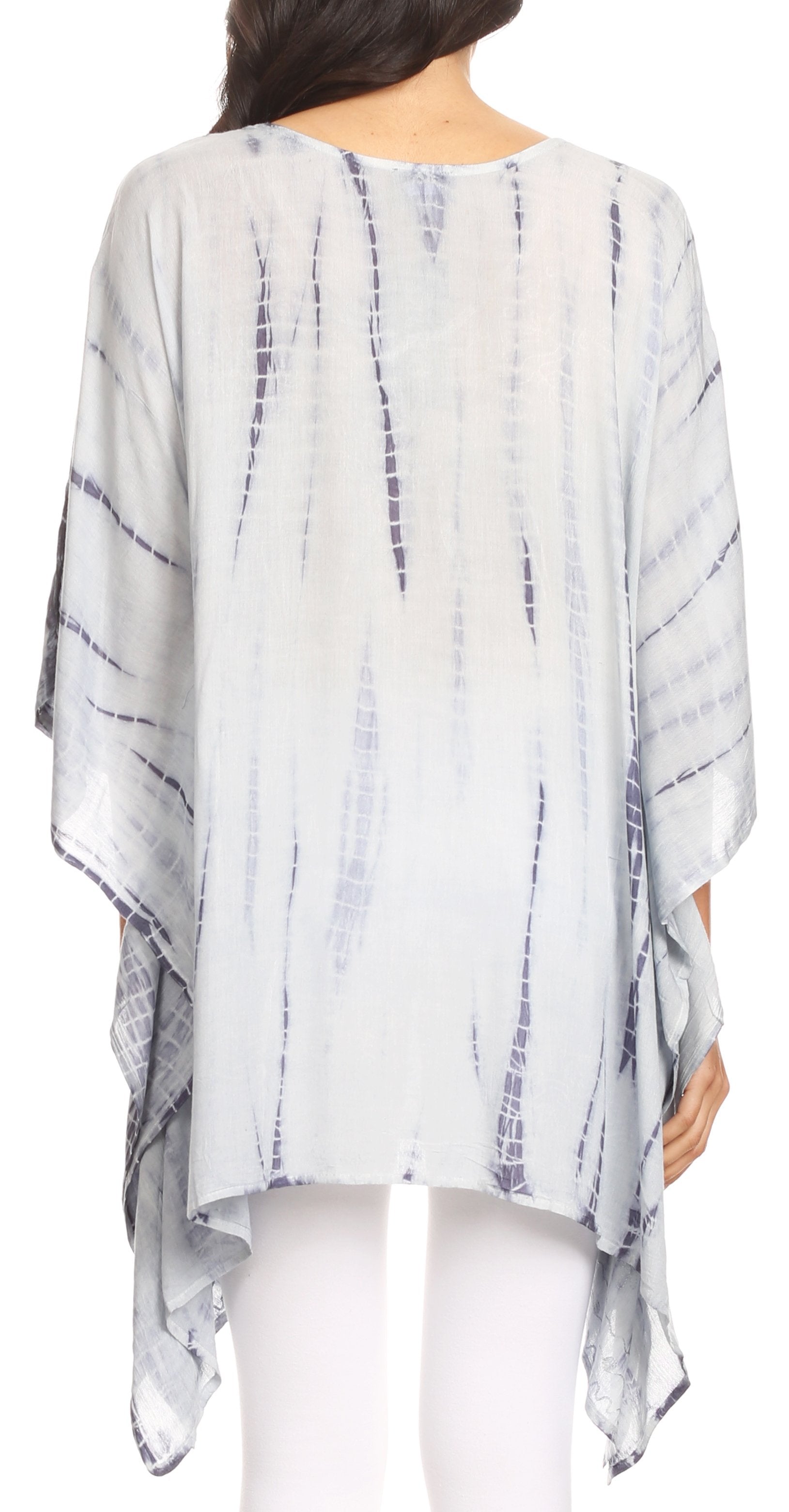 Lightweight, tie-dye patterned poncho worn by a person on a white background