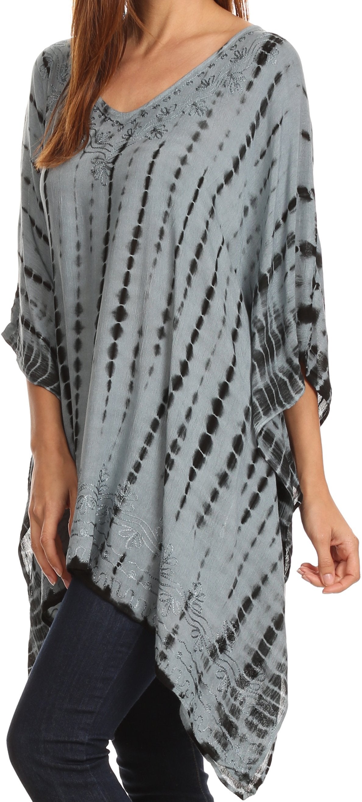 Gray tie-dye poncho worn by a person on a white background