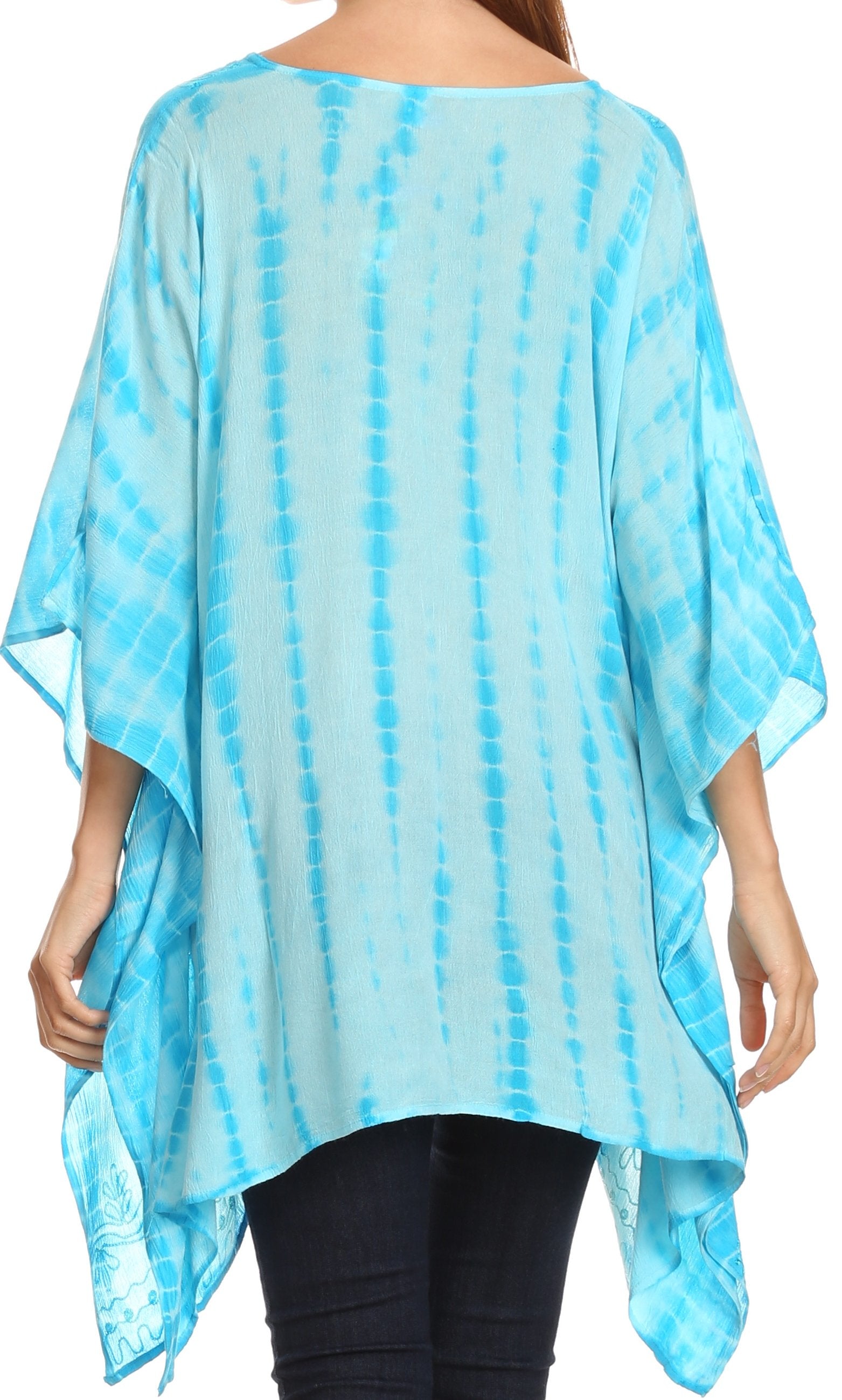Light blue tie-dye poncho worn by a person on a white background