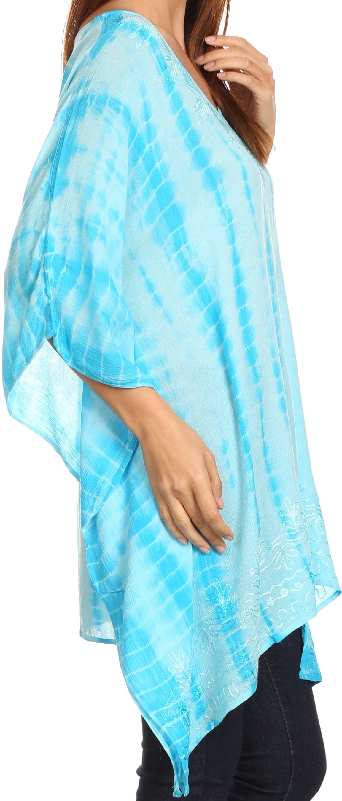 Light blue tie-dye poncho worn by a person on a white background