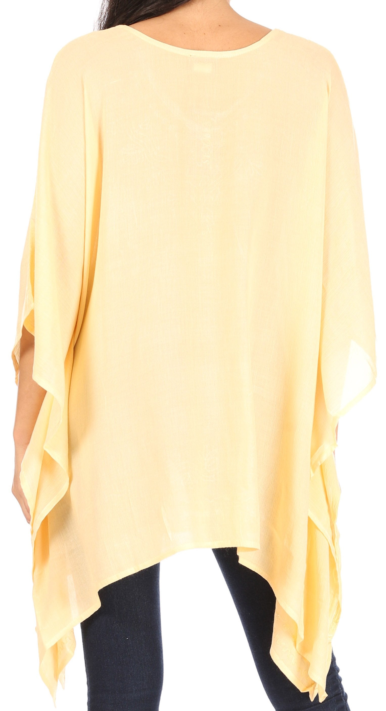 Yellow poncho worn by a person on a white background