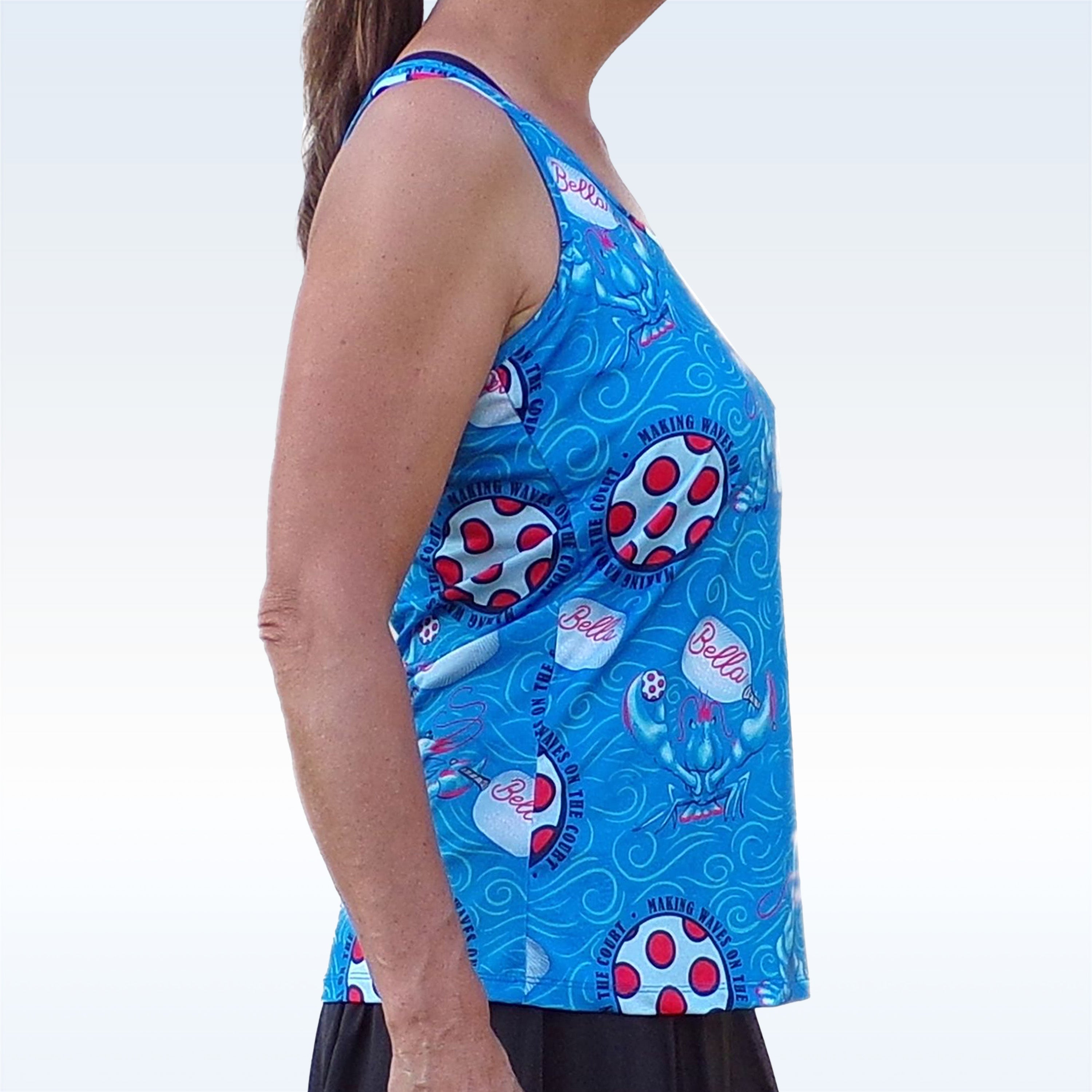 Person wearing a blue sleeveless top with cartoon character pattern on a white background