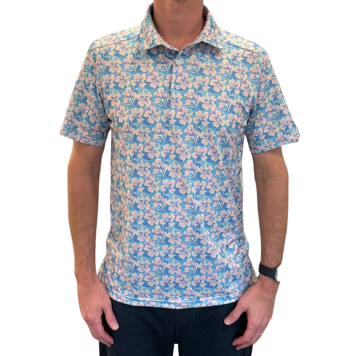 Man wearing a floral patterned shirt on a white background