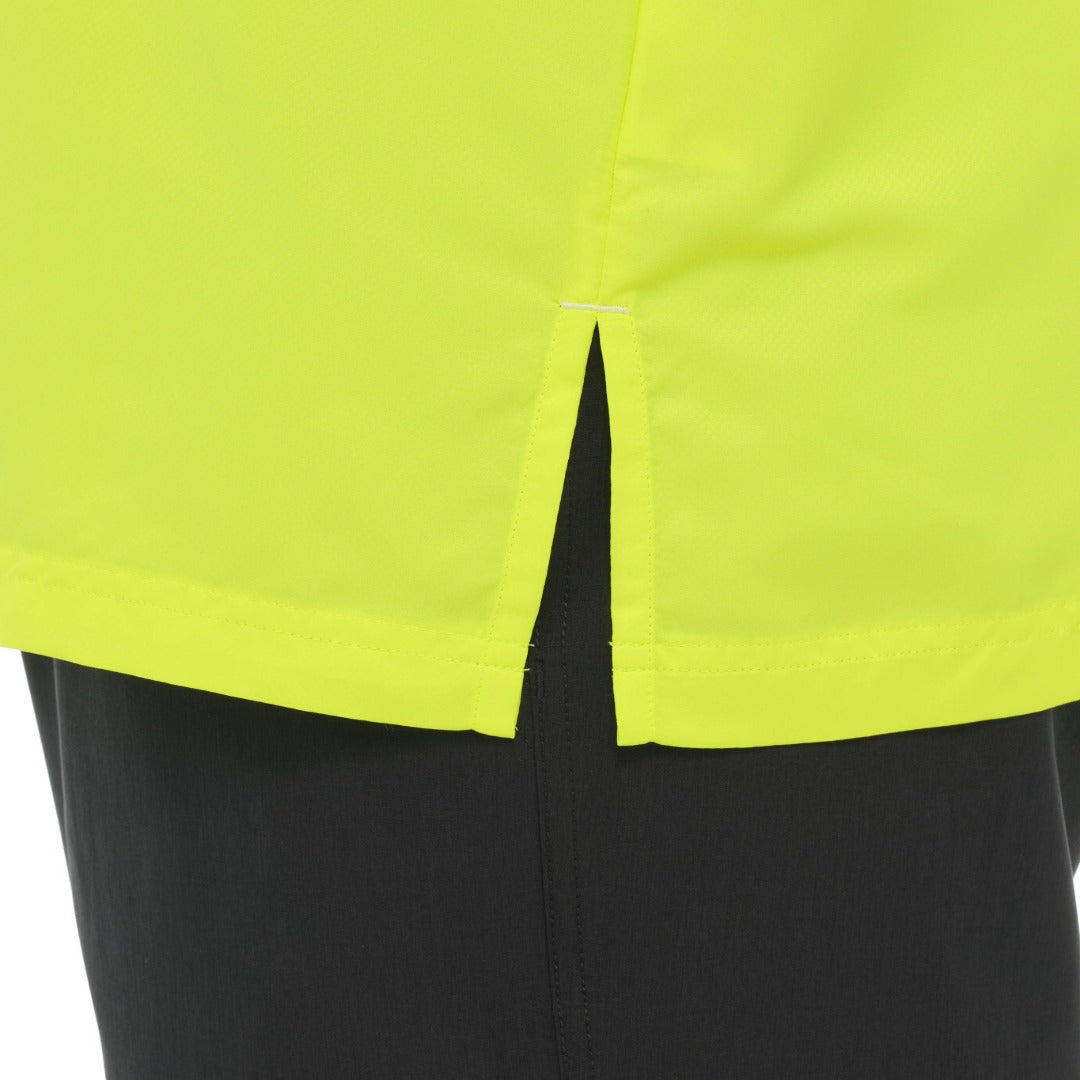 Close-up of a bright yellow garment with a black background