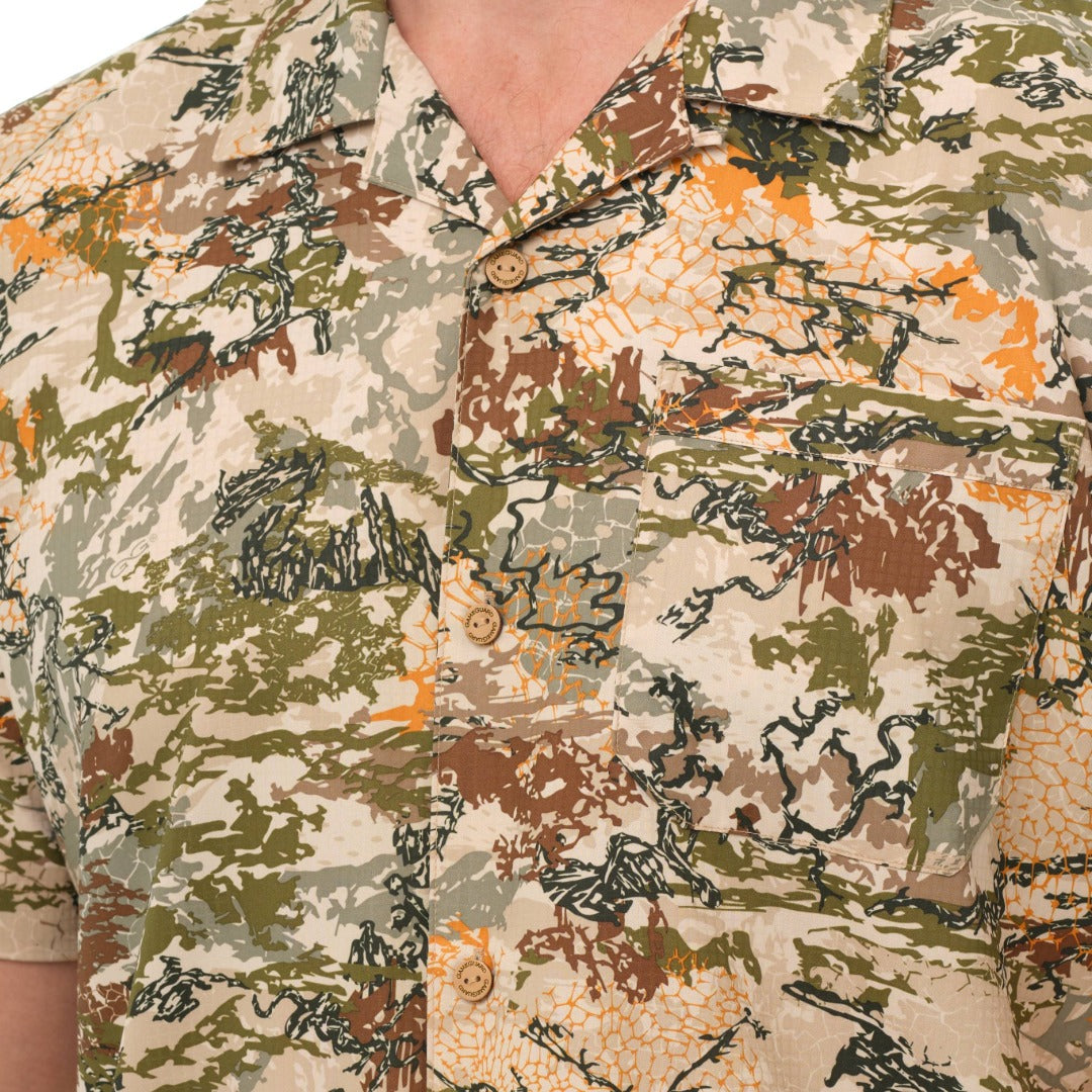 Camouflage-patterned shirt with a focus on the design and colors used.