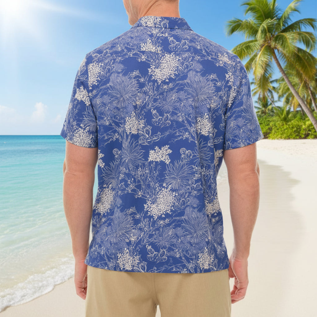 Man wearing a blue floral patterned shirt on a white background
