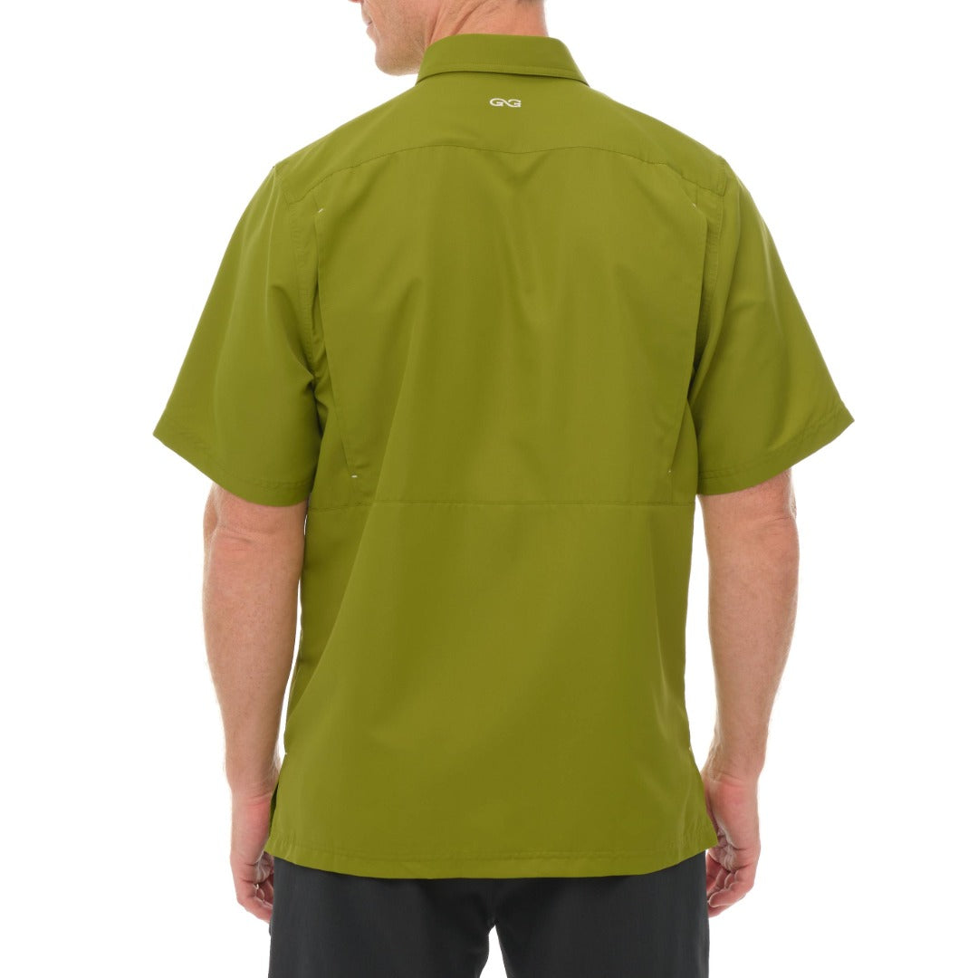 Green shirt worn by a person on a white background