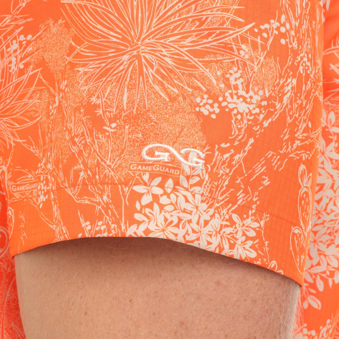 Orange swim shorts with white floral pattern and GameGuard logo.