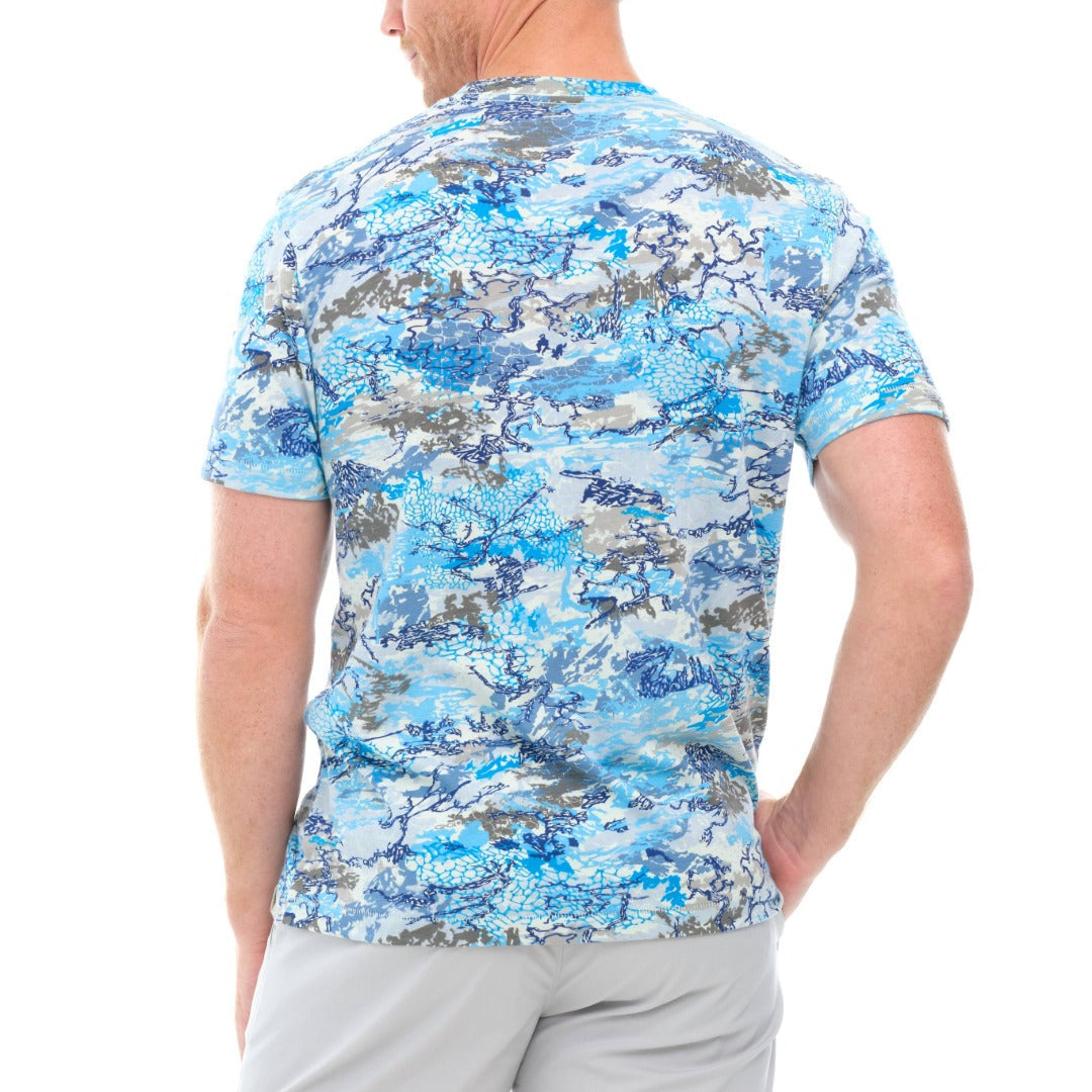 Person wearing a blue camouflage shirt on a white background