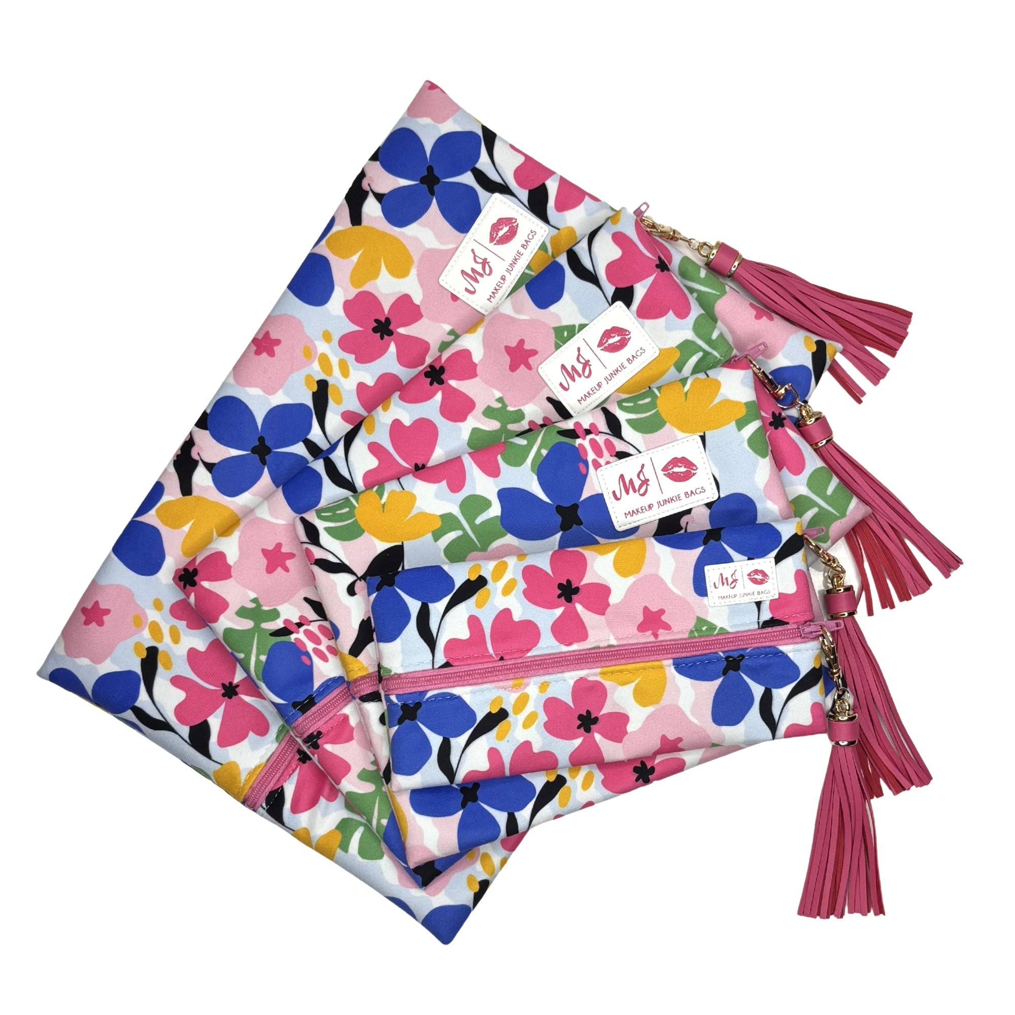 Floral-patterned pouches with pink tassels on a white background
