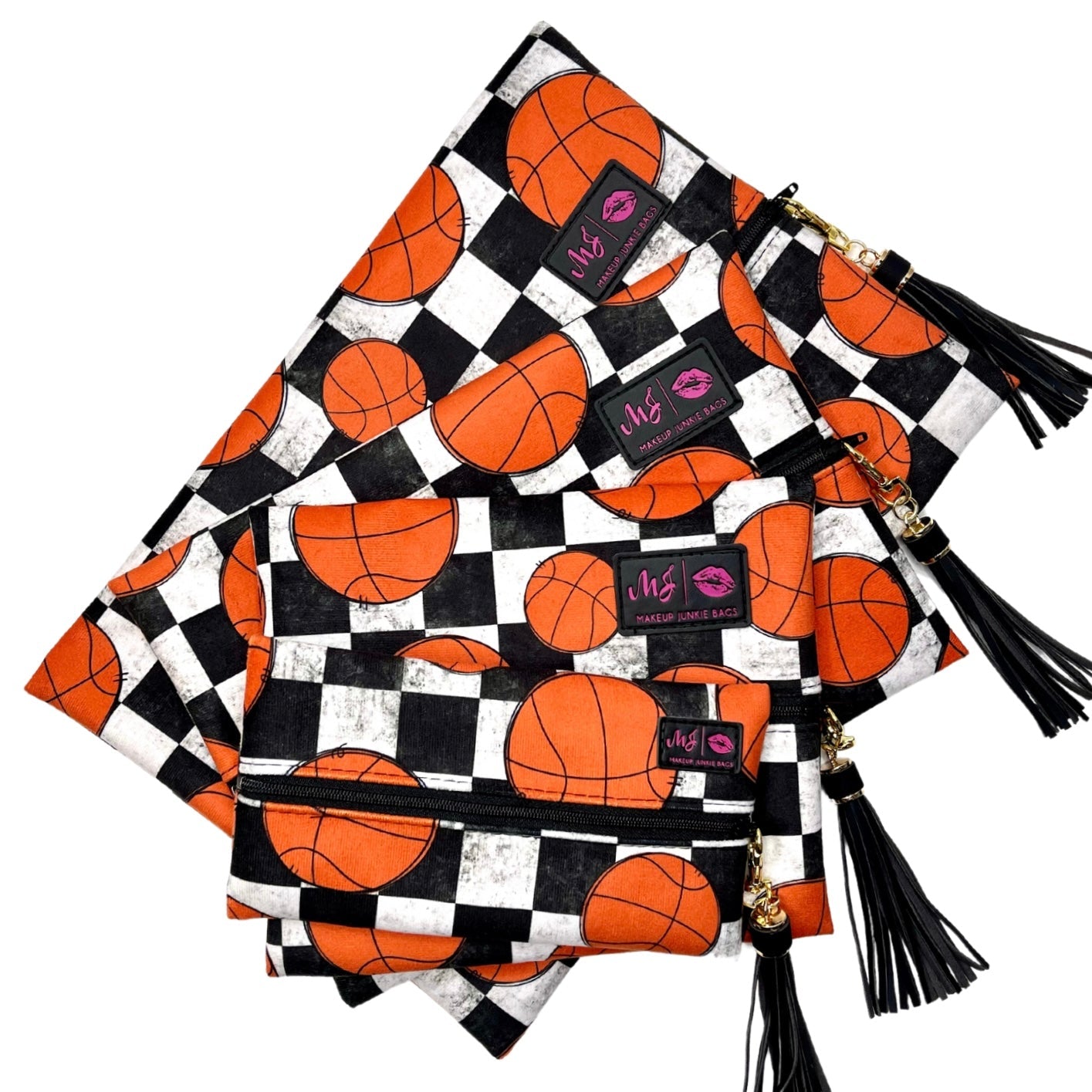 Set of three pouches with basketball pattern and black tassels on a white background