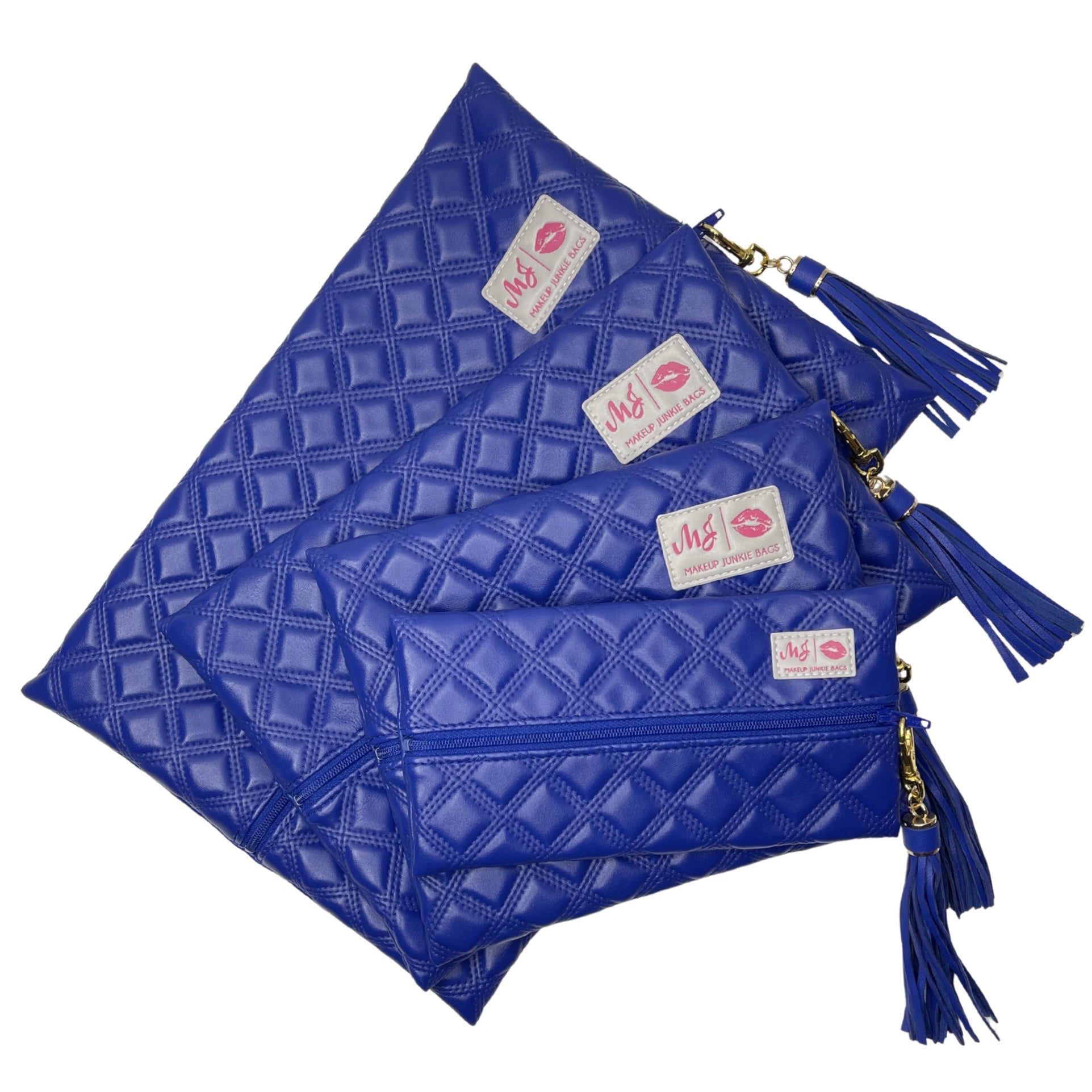 Set of blue quilted pouches with tassels and visible brand labels on a white background