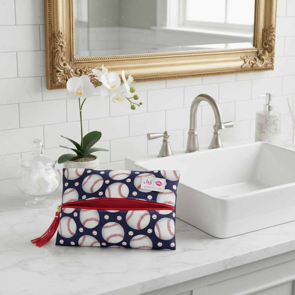 Makeup bag with baseball pattern and red zipper on a white background