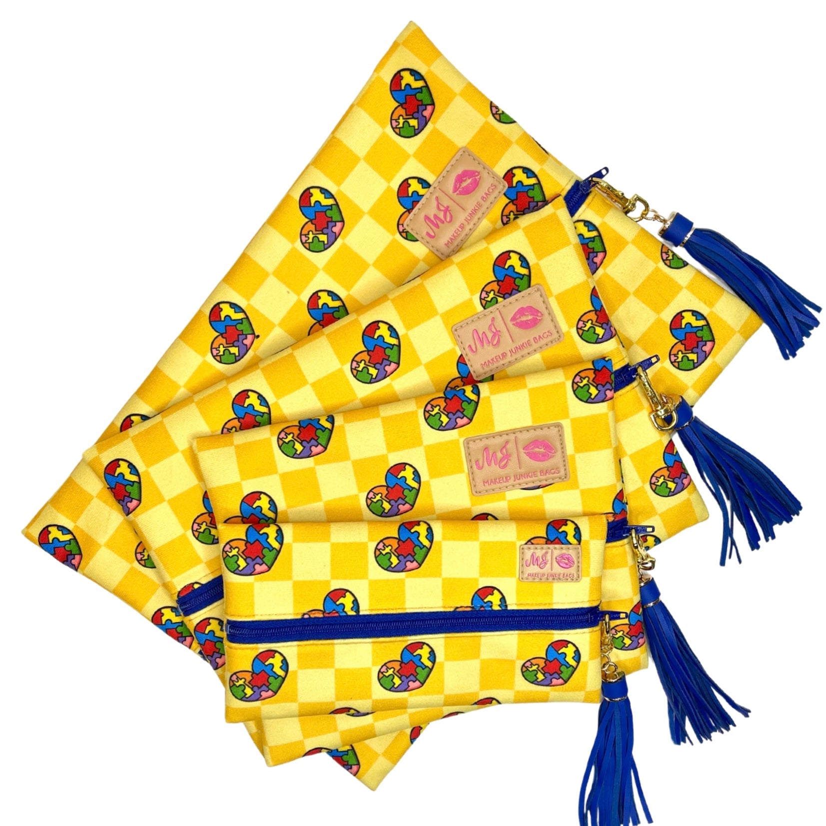 Yellow checkered bags with colorful patterns and blue tassels on a white background