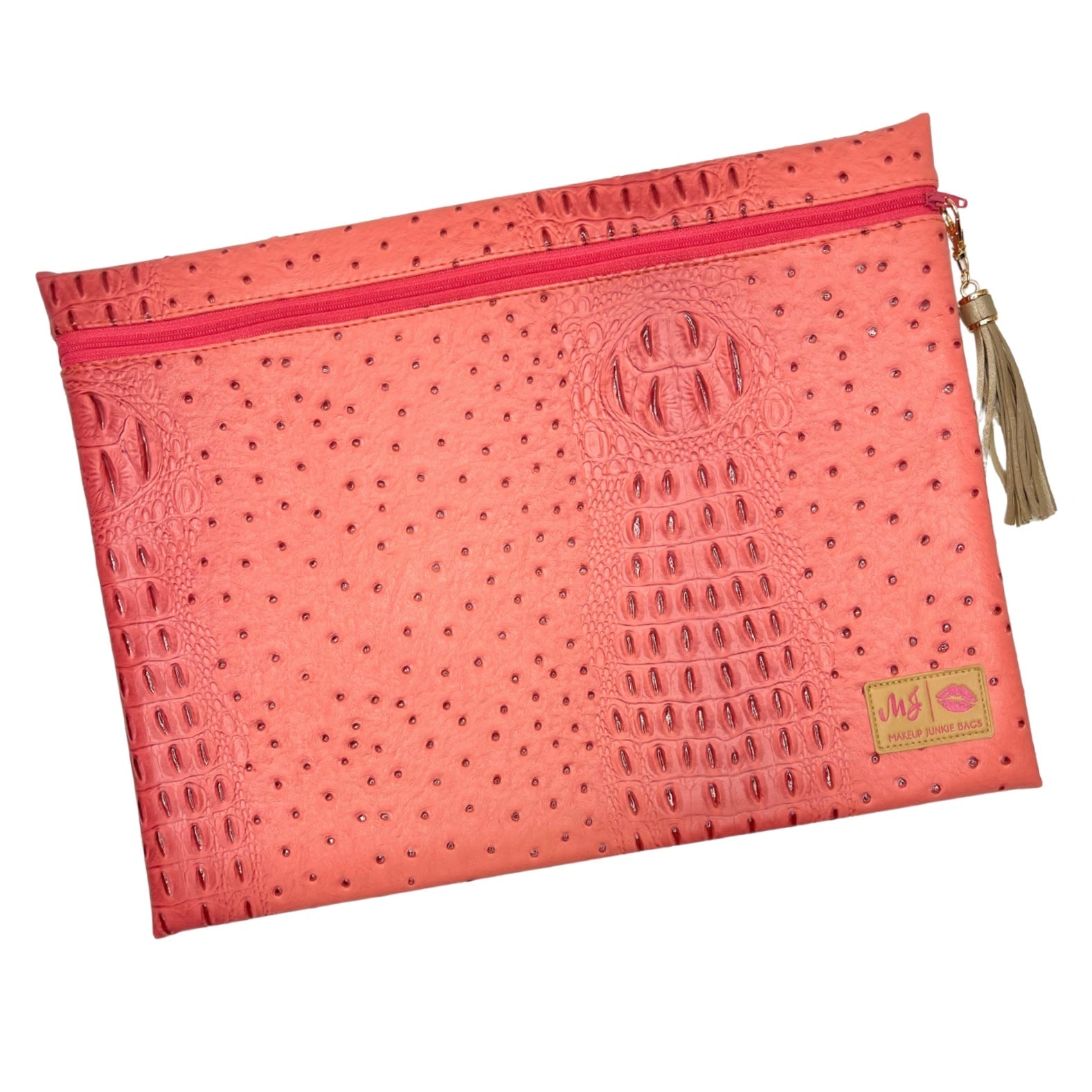 Pink pouch with embossed pattern, zipper, and tassel on a white background