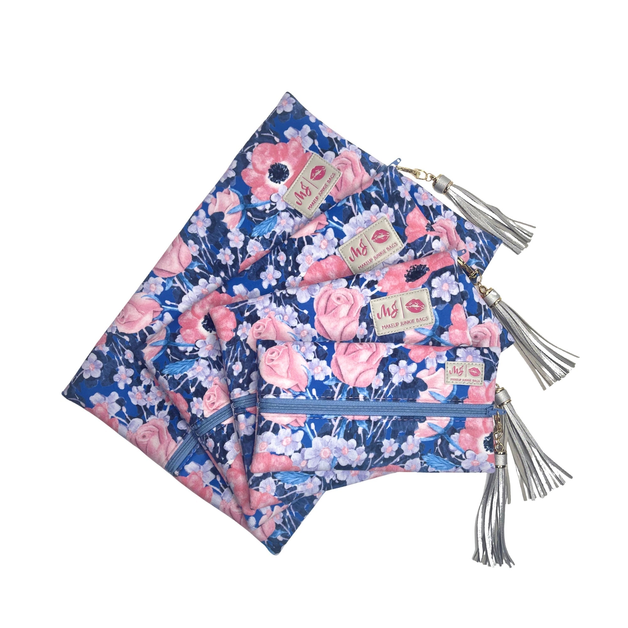 Floral patterned pouches with tassels on a white background