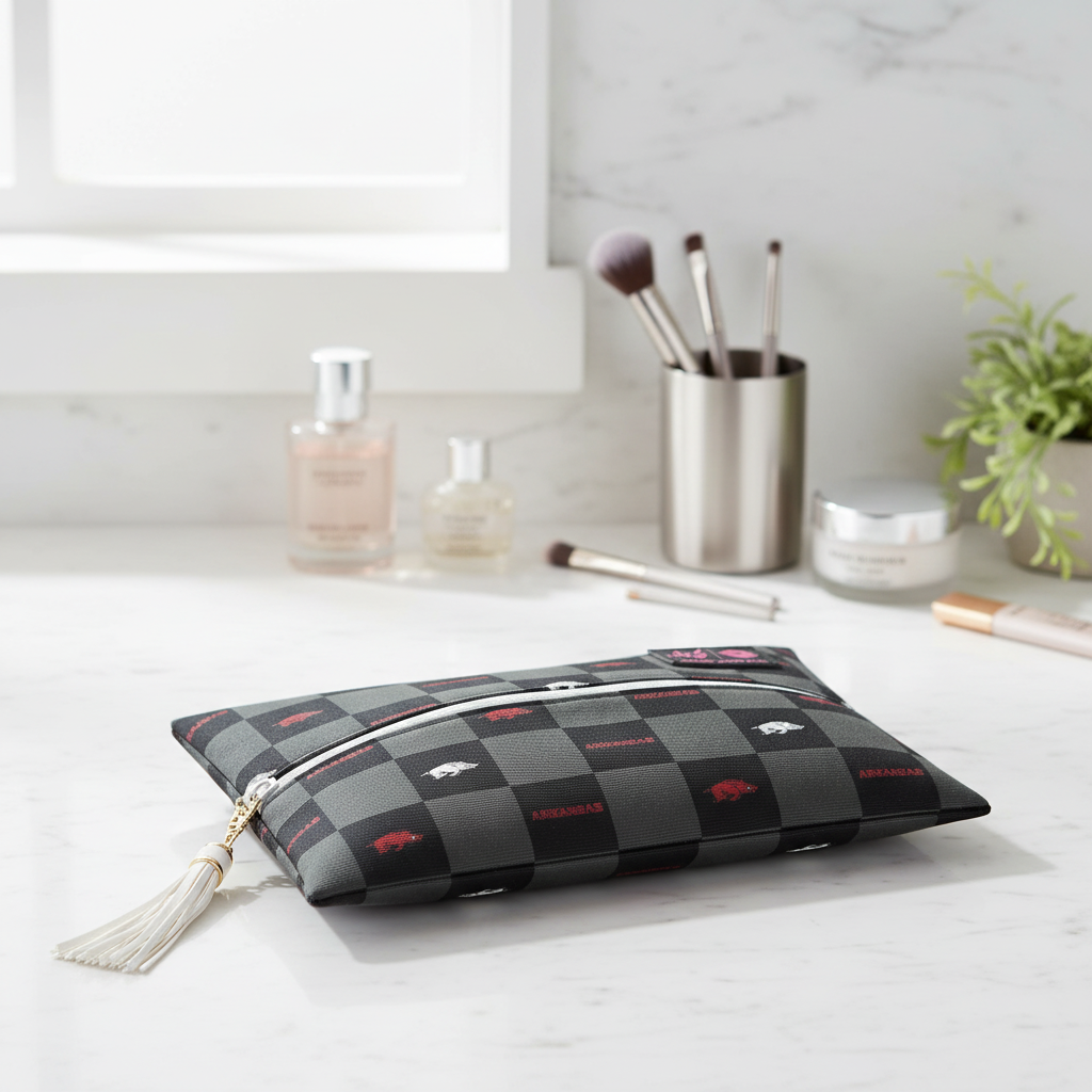 Makeup bag with checkered pattern and tassel on a white background