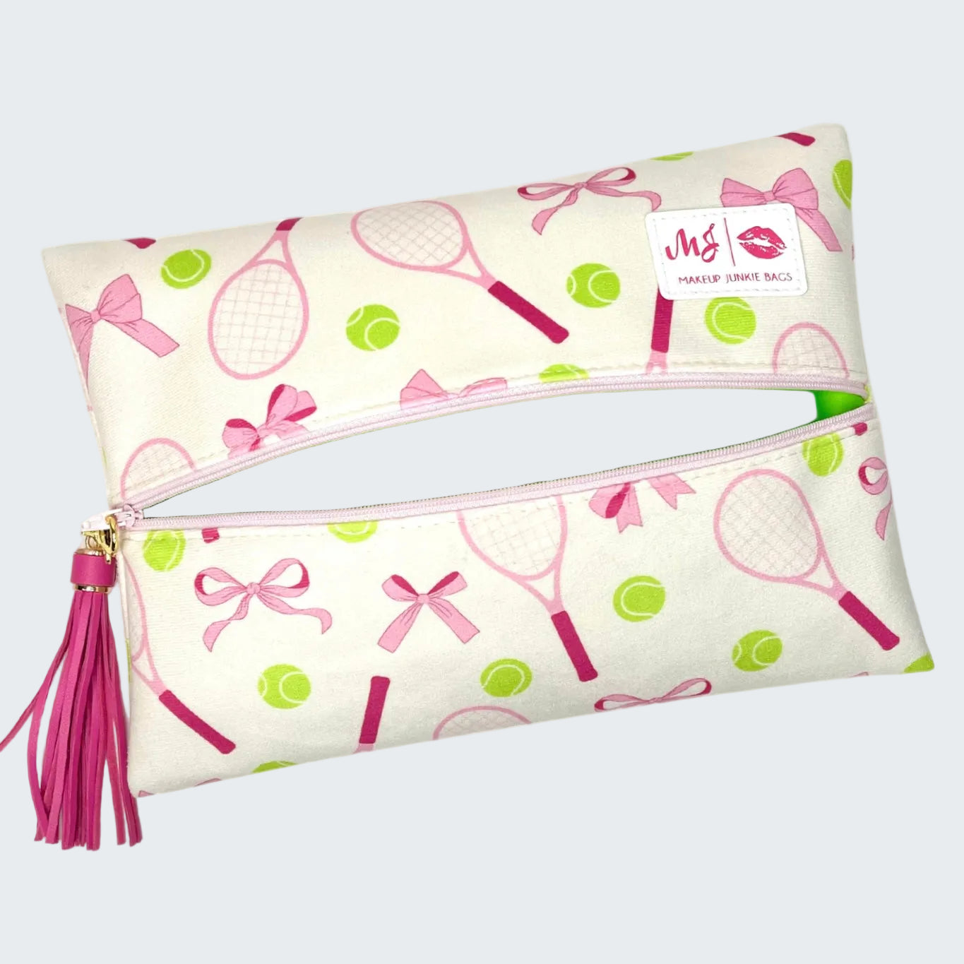 Makeup bag with tennis racket and bow pattern on a white background
