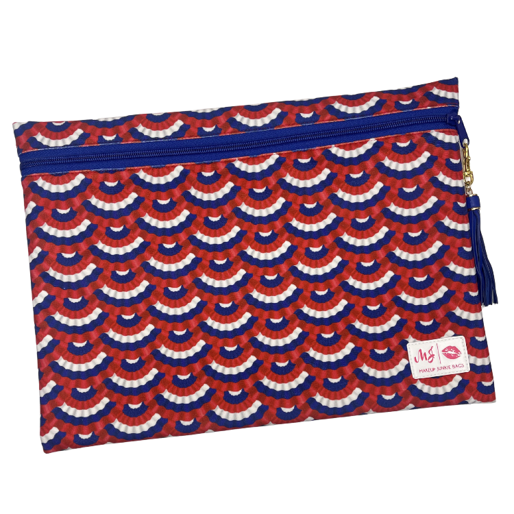 Red, white, and blue patterned pouch with a visible brand label on a white background