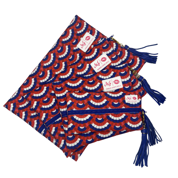 Red, white, and blue patterned bags with tassels on a white background