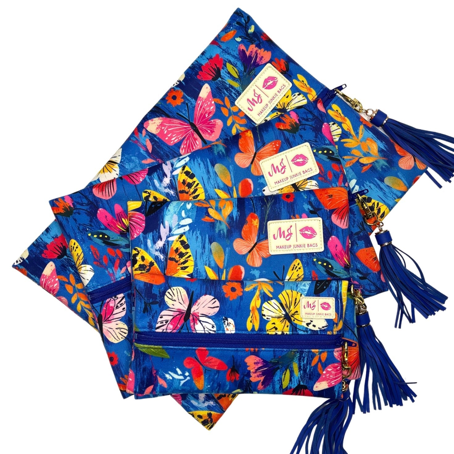 Colorful butterfly-patterned bags with tassels on a white background