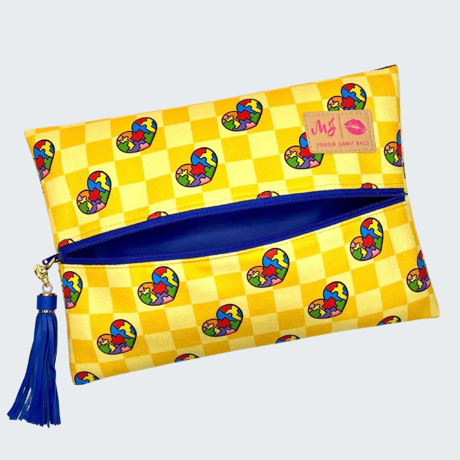 Yellow checkered pouch with colorful heart patterns and a blue zipper on a white background