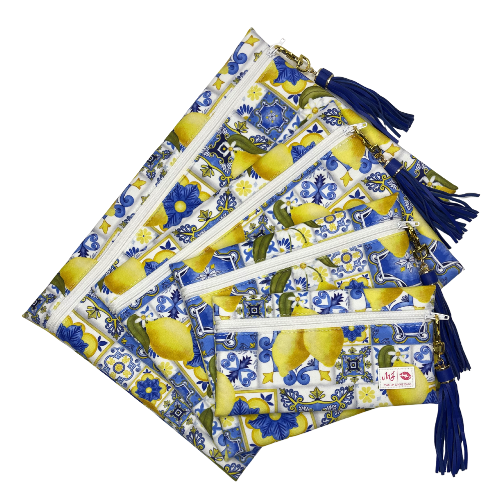 Set of pouches with lemon and floral pattern on a white background