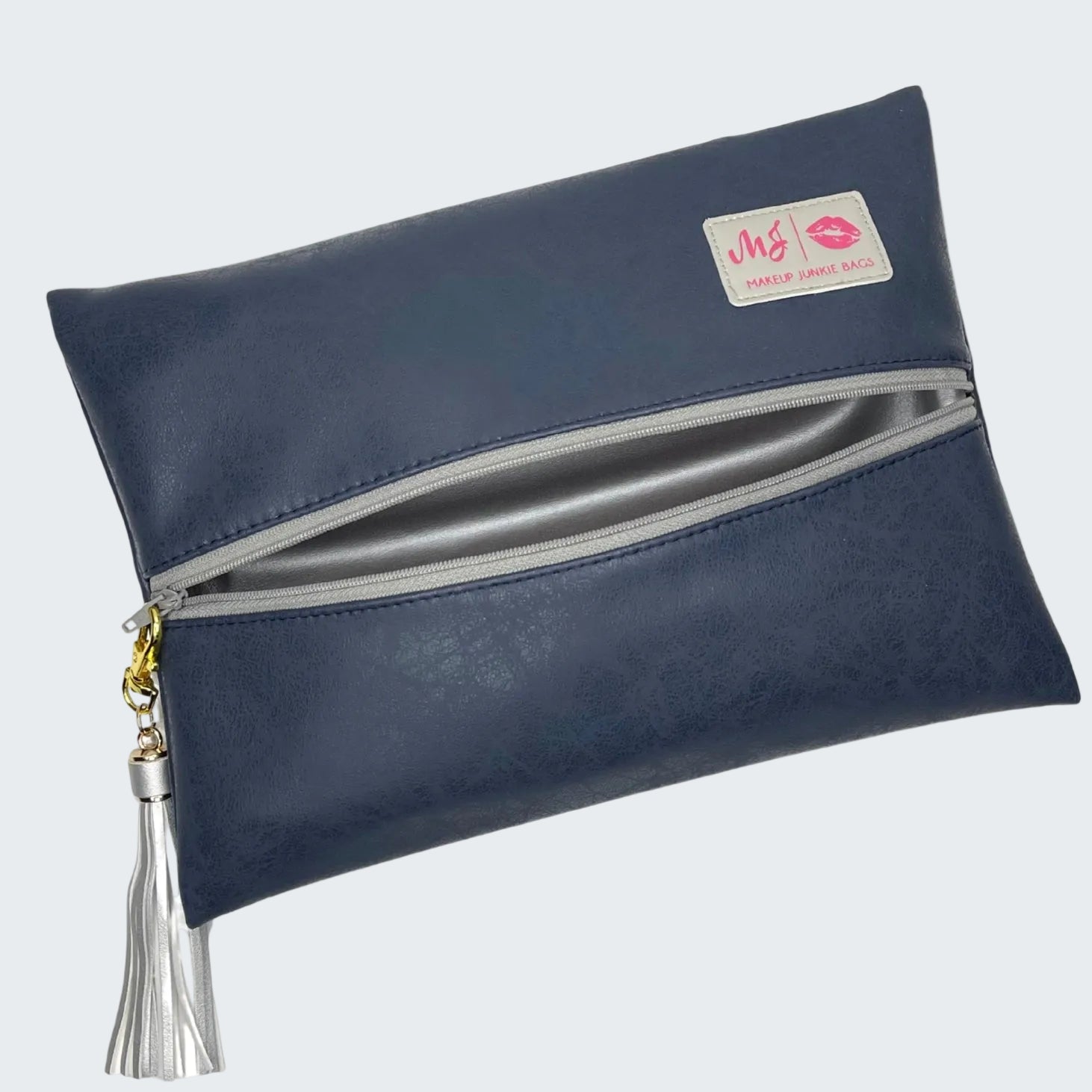 Navy blue clutch bag with a tassel on a white background