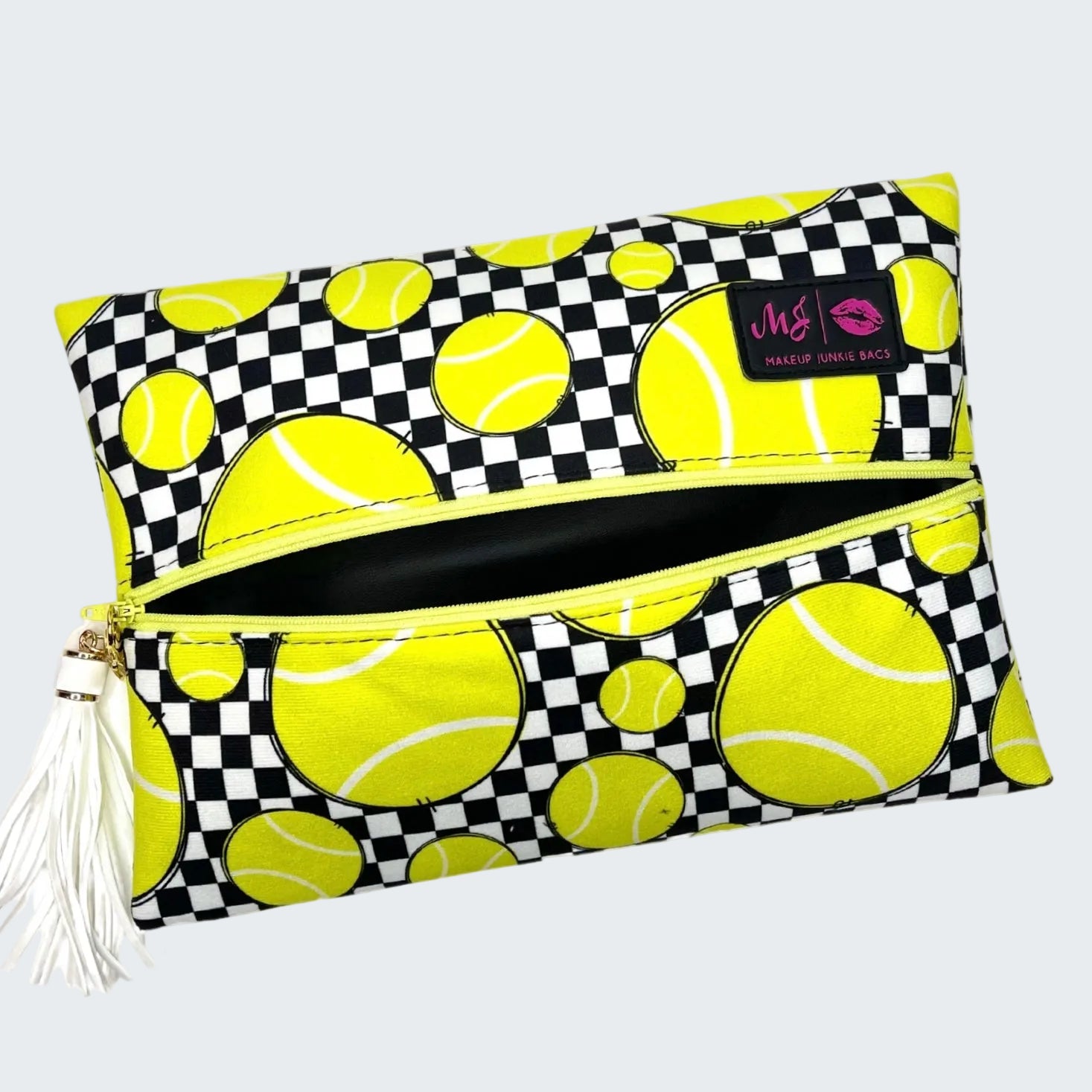 Clutch bag with tennis ball pattern on a white background