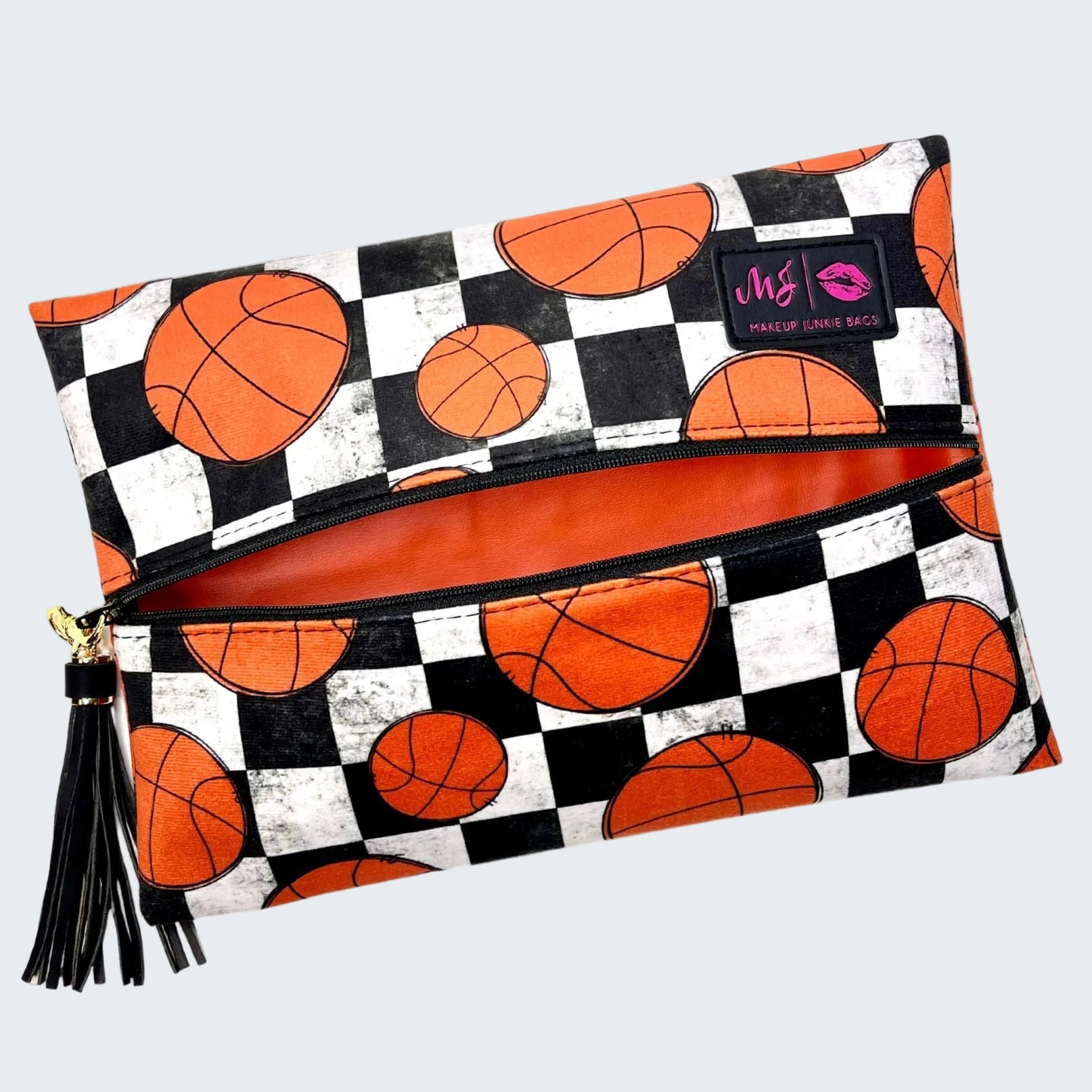 Makeup bag with basketball pattern and visible brand logo on a white background