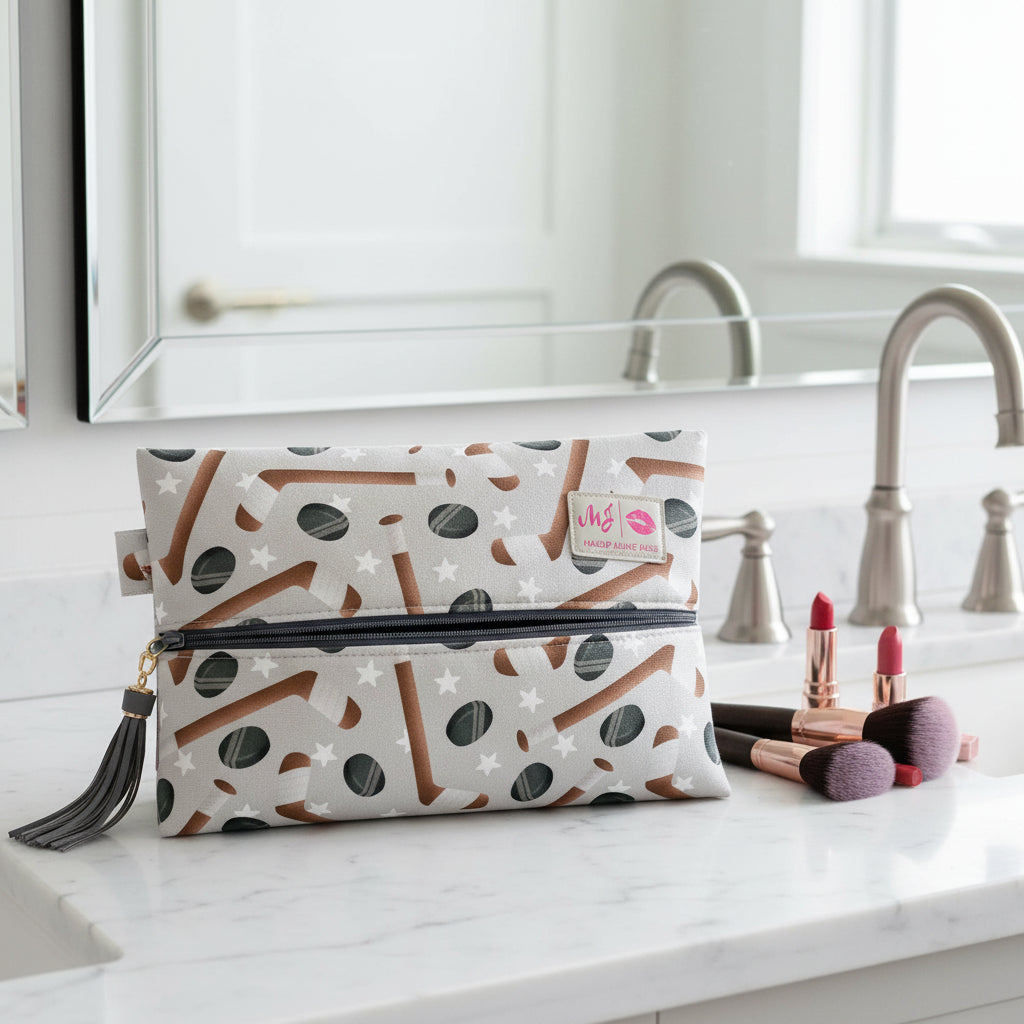 Makeup bag with star and boot pattern on a light gray background