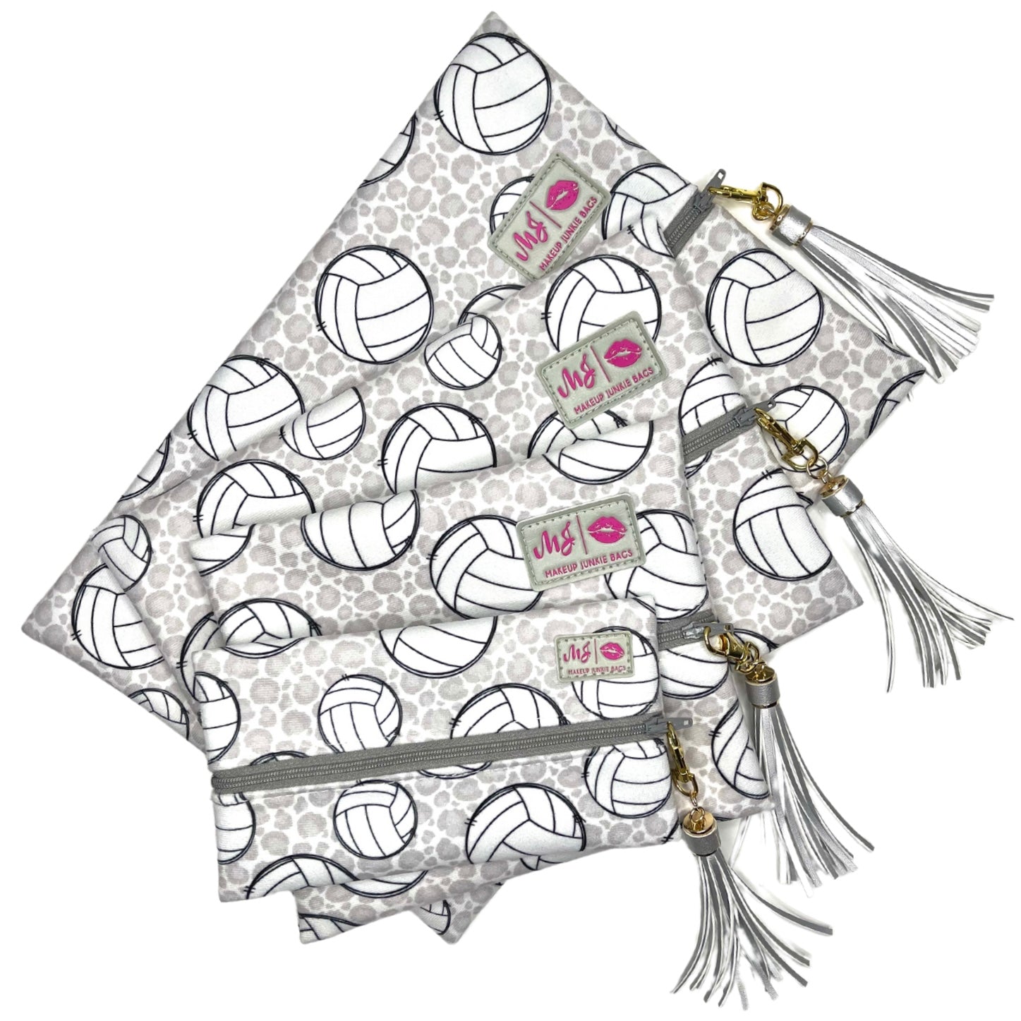 Set of three pouches with volleyball pattern and tassels on a white background