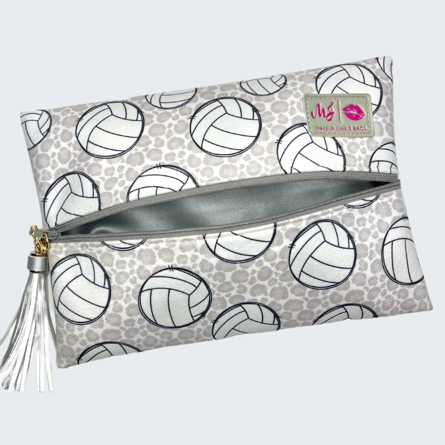 Clutch bag with volleyball pattern and tassel on a white background