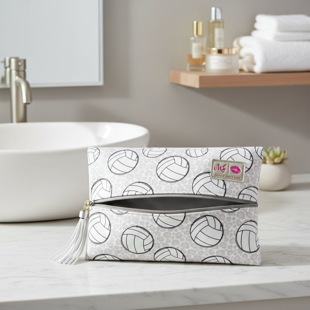 Clutch bag with volleyball pattern and tassel on a white background