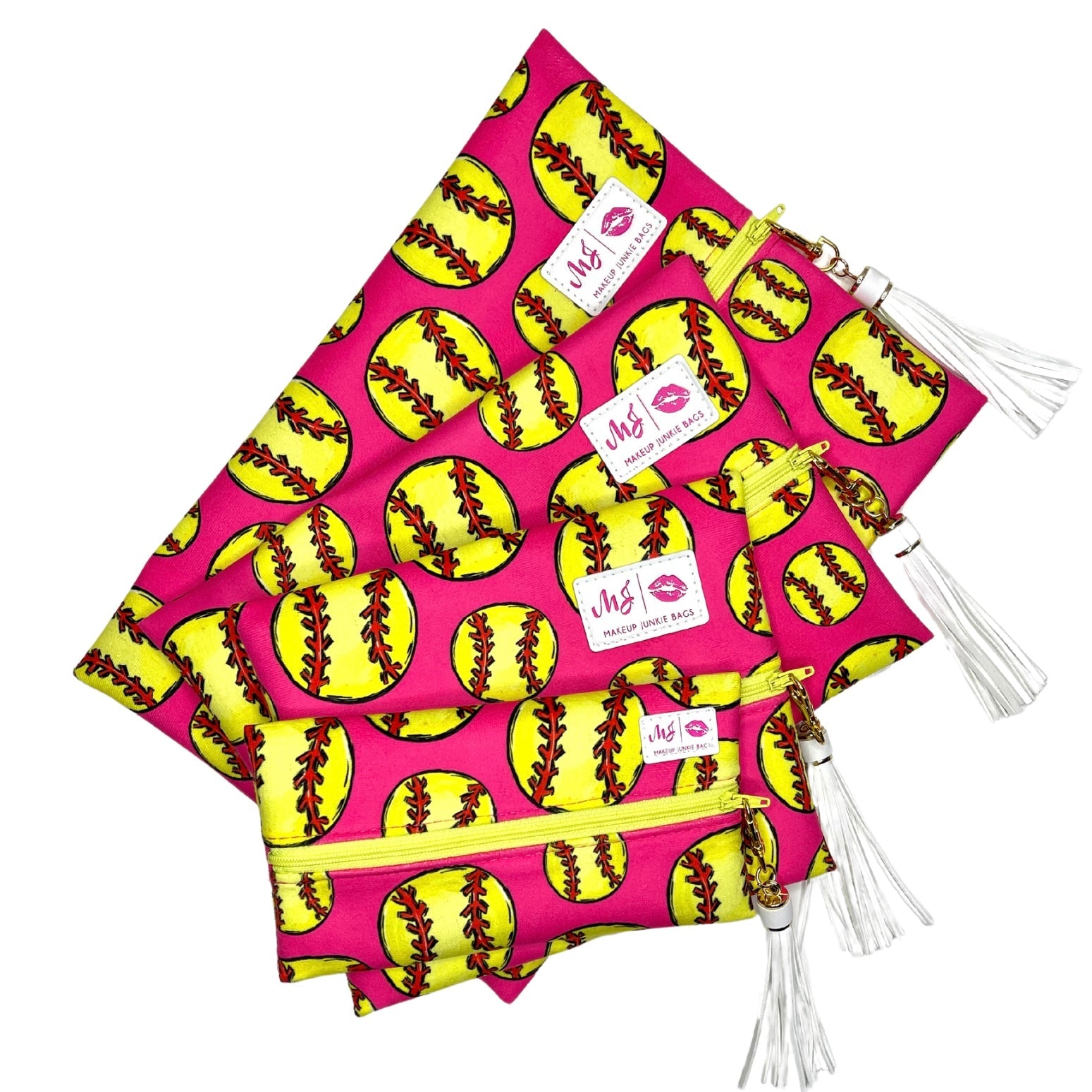 Two pink bags with yellow softball pattern and white tassels on a white background