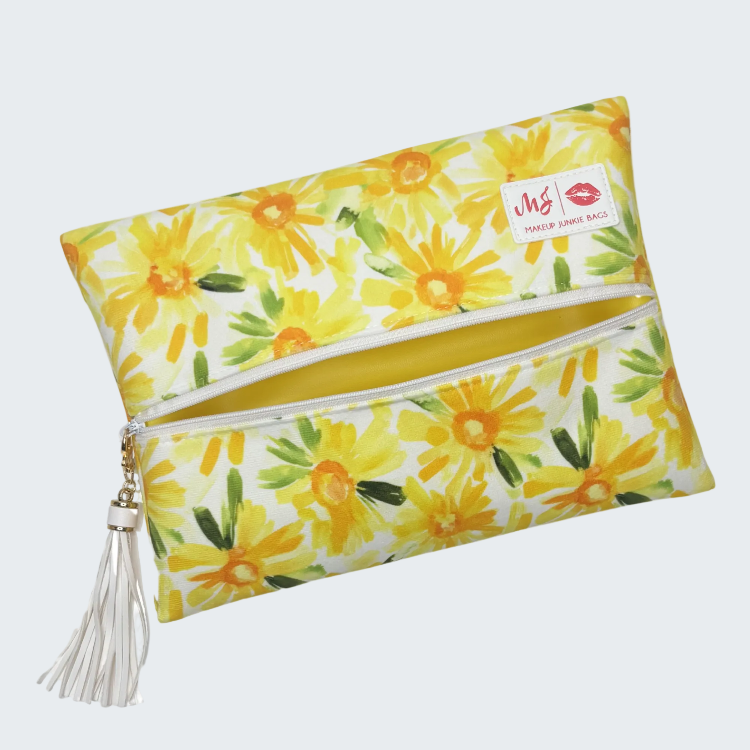 Floral-patterned pouch with a tassel on a white background