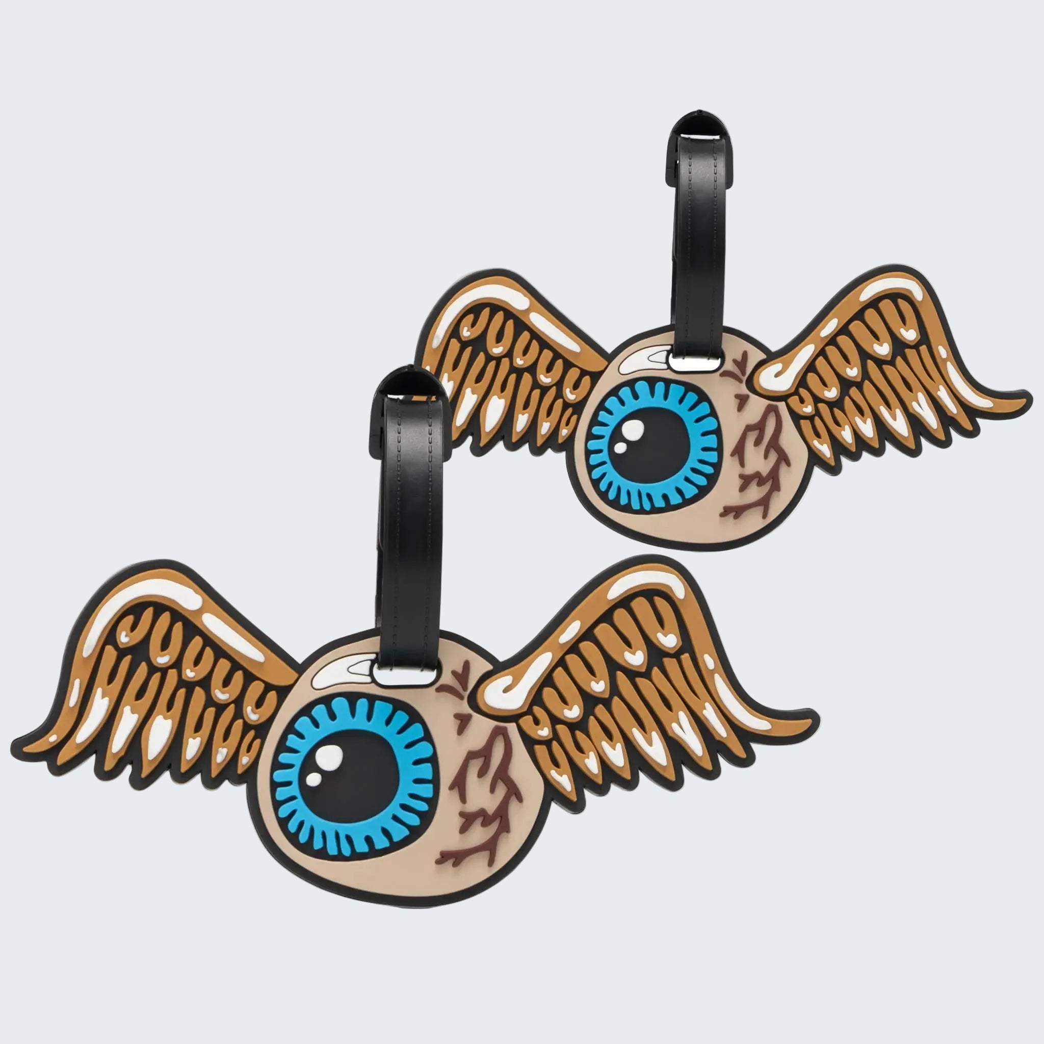 Two winged eye-shaped luggage tags on a white background