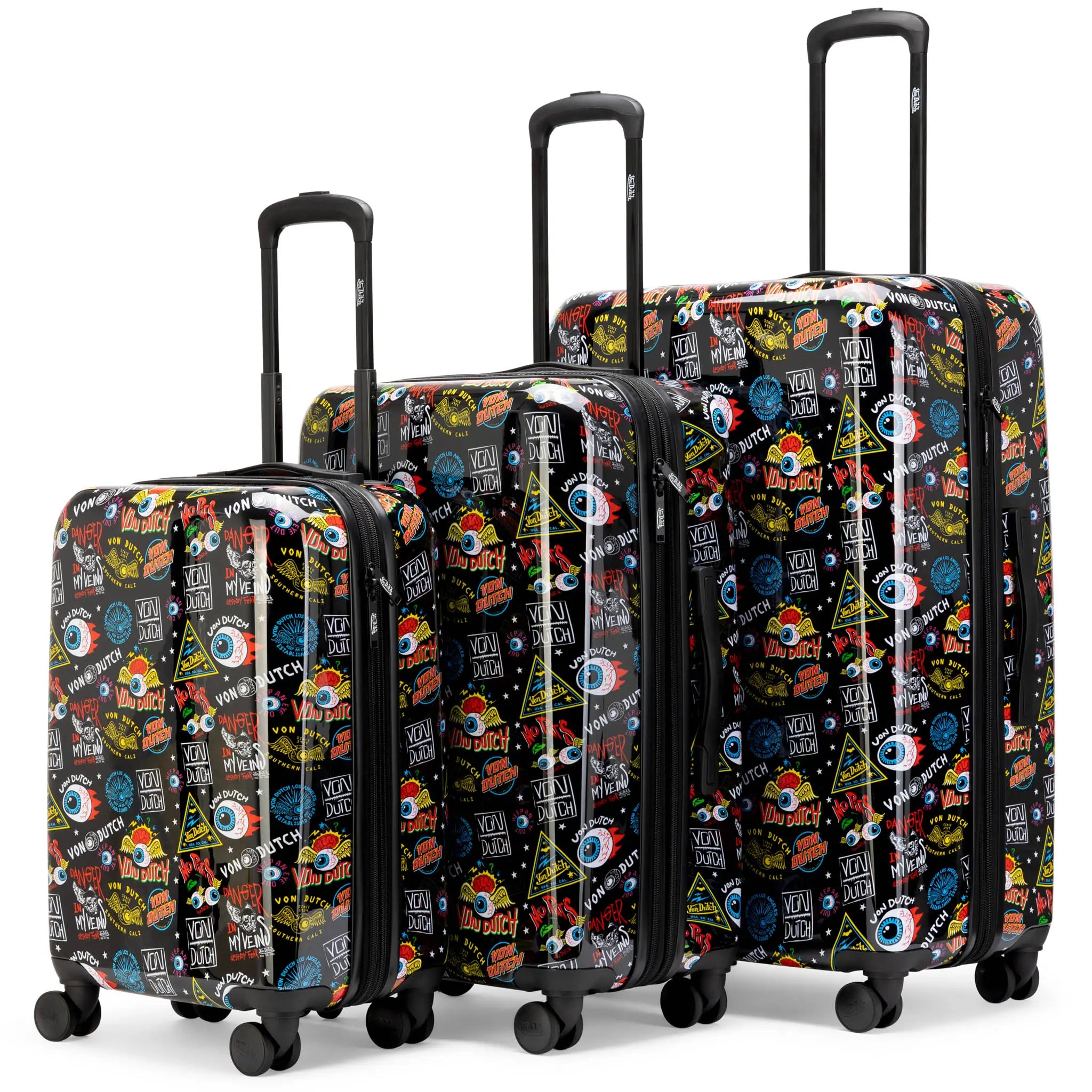 Set of three patterned suitcases with visible brand on a white background