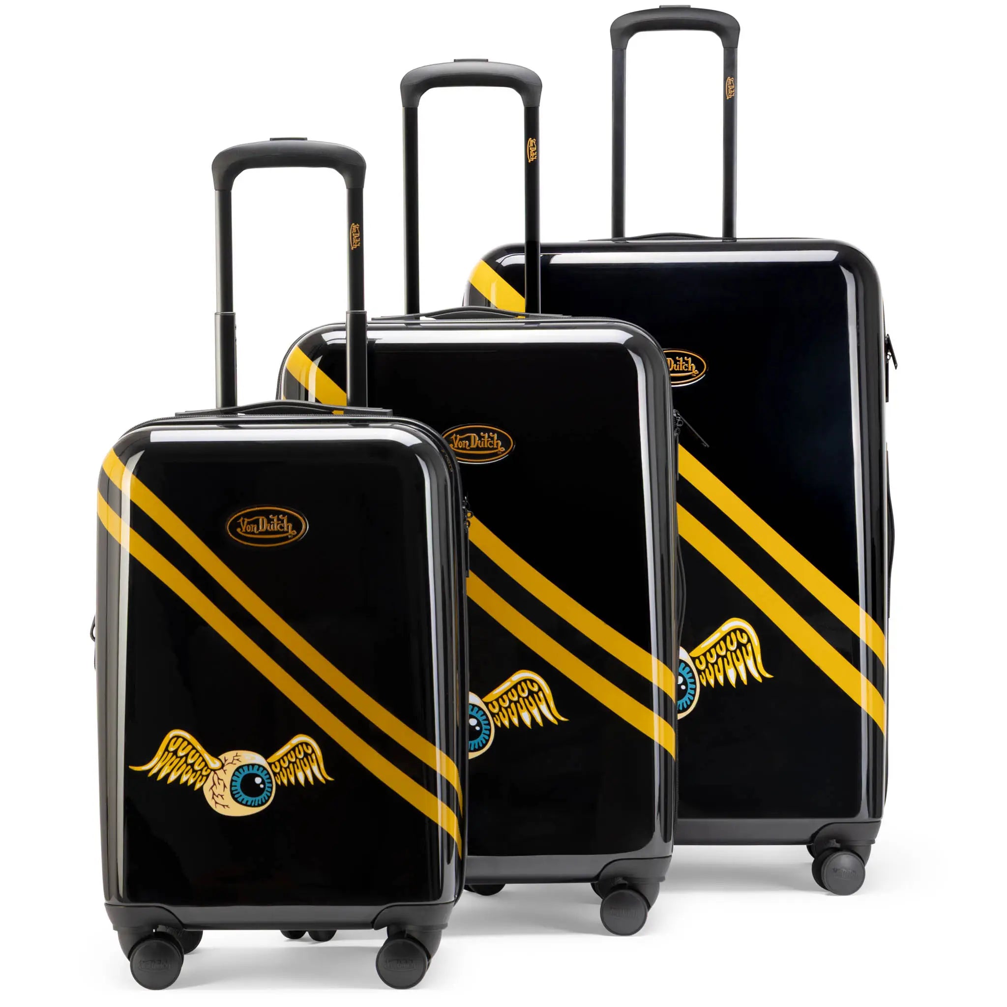 Set of black suitcases with gold stripes and winged emblem on a white background