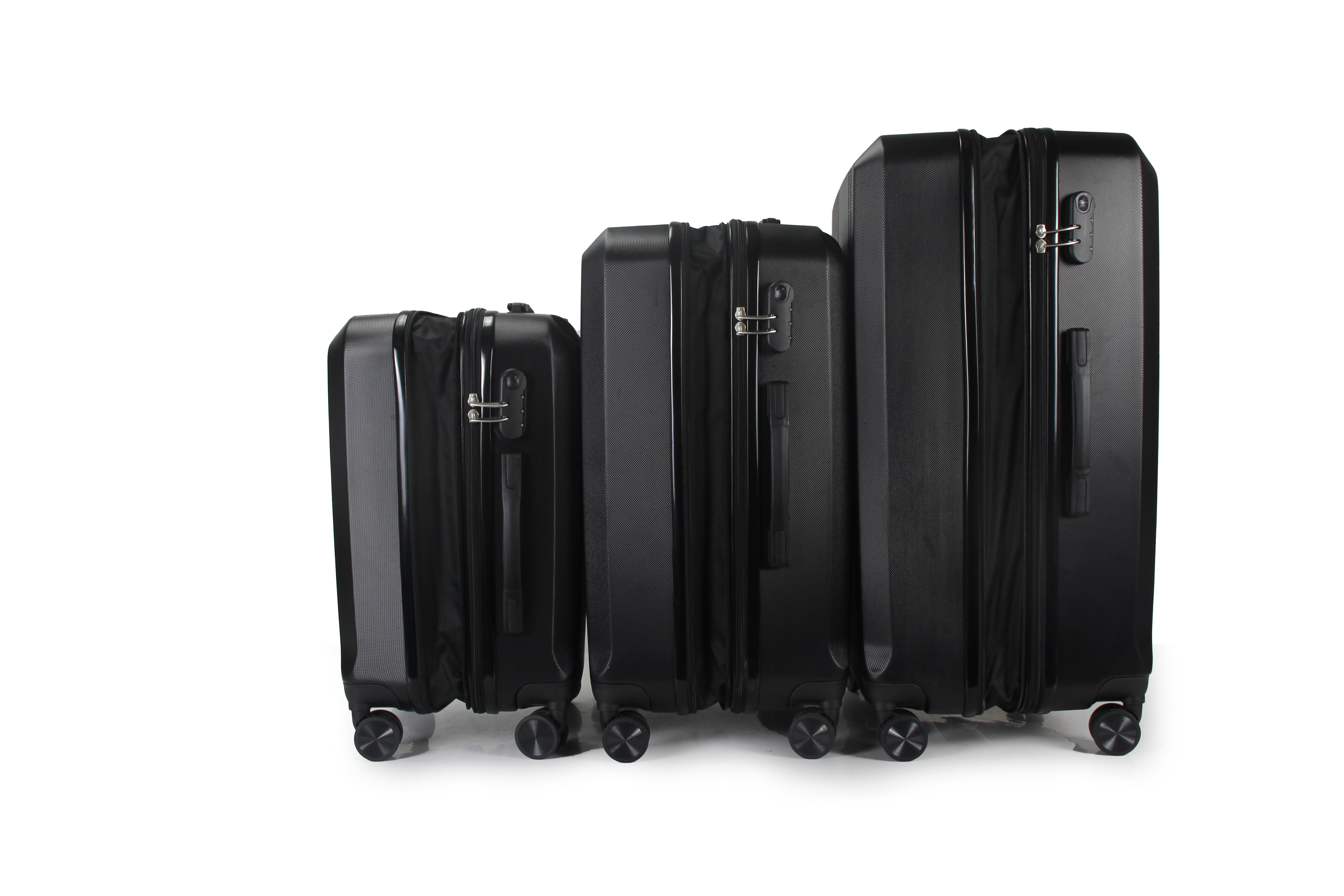 Set of black suitcases of different sizes on a white background