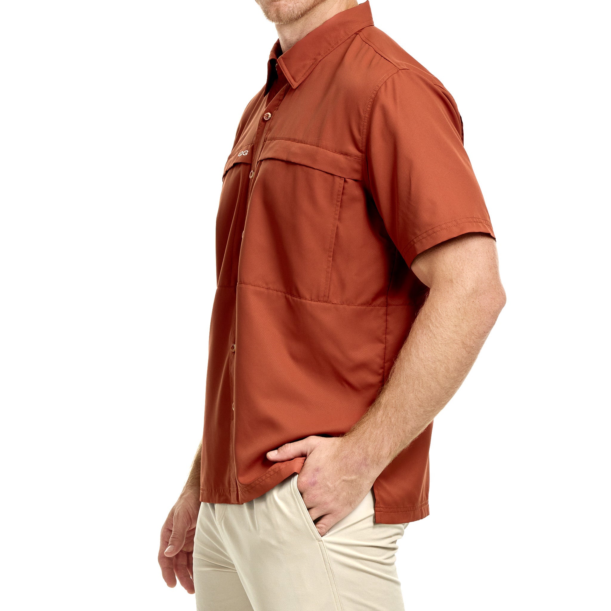 Man wearing a rust-colored short-sleeve shirt on a white background